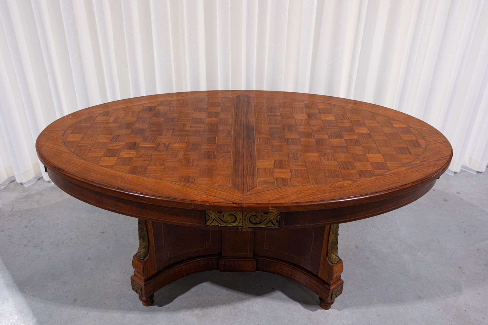 An antique parquetry and veneer wood oval dining table with gilt bronze mountings (1 of 5)