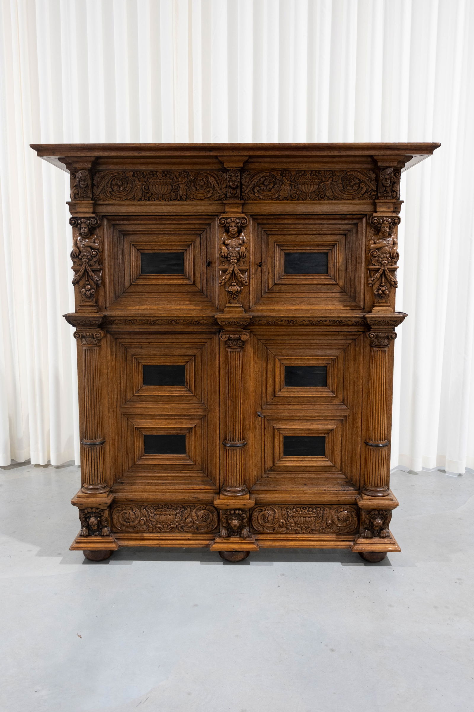 An antique Dutch carved oak Renaissance style decorated four doors cabinet (1 of 9)