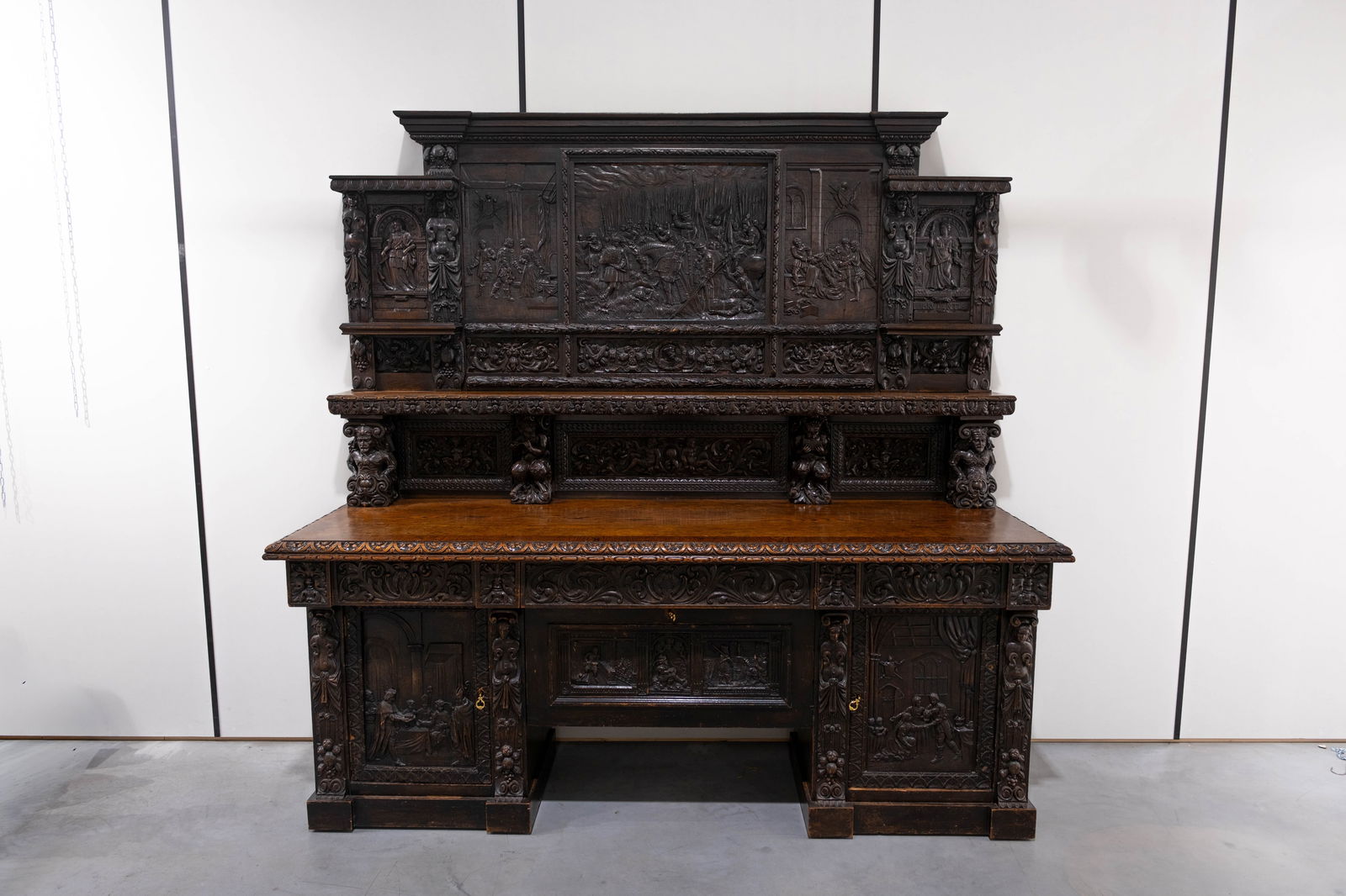 An imposing and antique carved oak credenza with various richly decorated mythological scene (1 of 16)