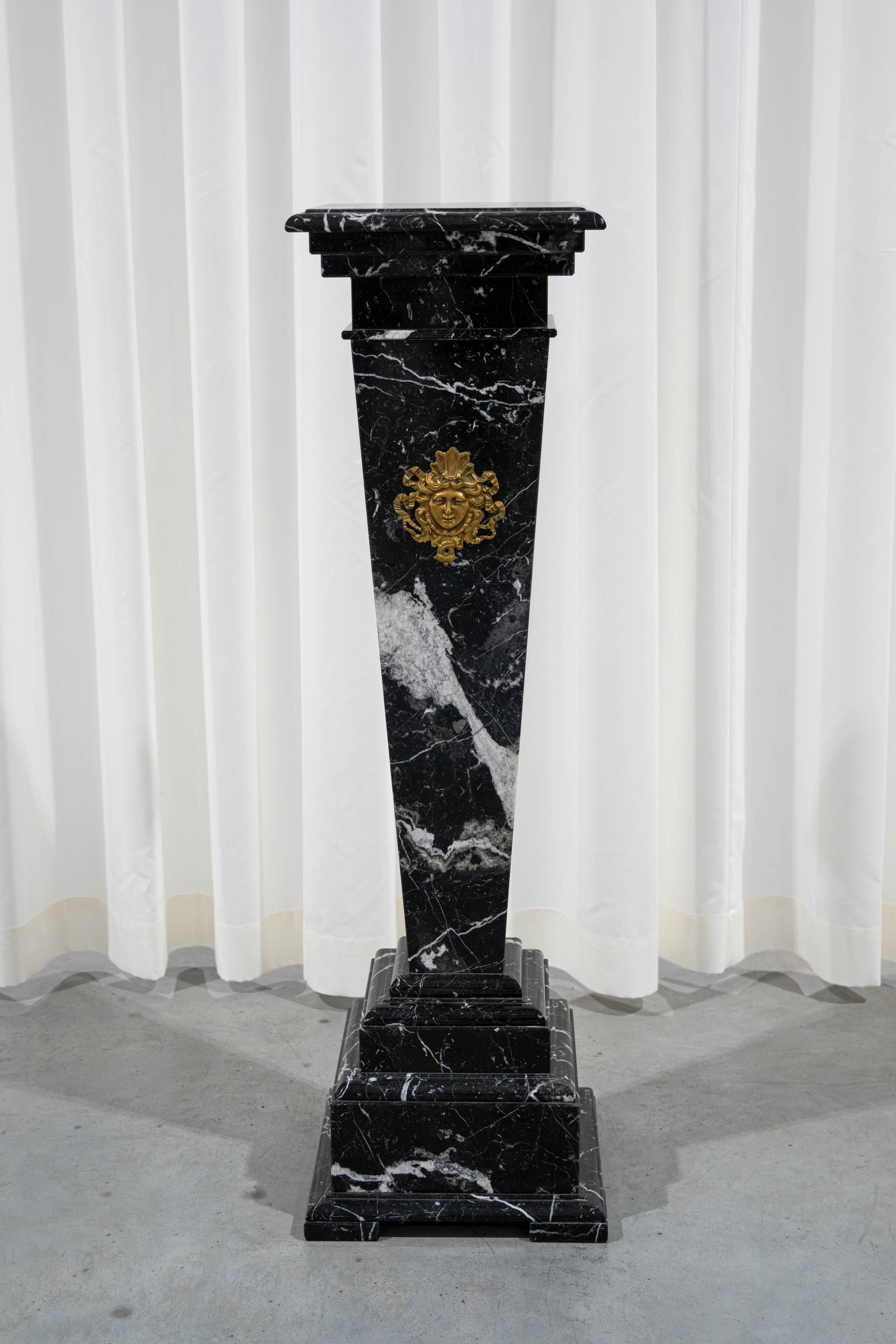 A black and white flamed square marble column pedestal with brass mounted ornament (1 of 5)