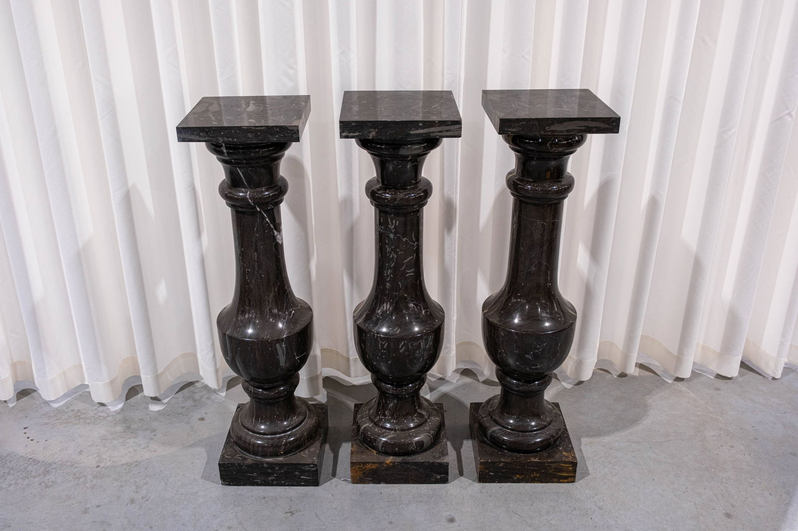 A lot of three matching neoclassical style marble pedestals (1 of 4)