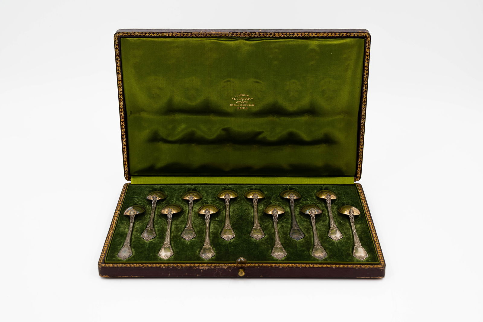 A complete set of twelve antique silver decorated small spoons (1 of 9)