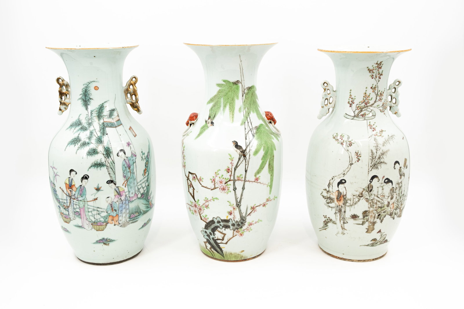 A lot of two Chinese Qianjiang cai porcelain vases, decorated with ladies in the garden and birds: A lot of three Chinese Qianjiang cai porcelain vases, decorated with ladies in the garden and birds. Backside contains calligraphy. 19th/20th century. Condition: one vase has a small bottom crack, oth