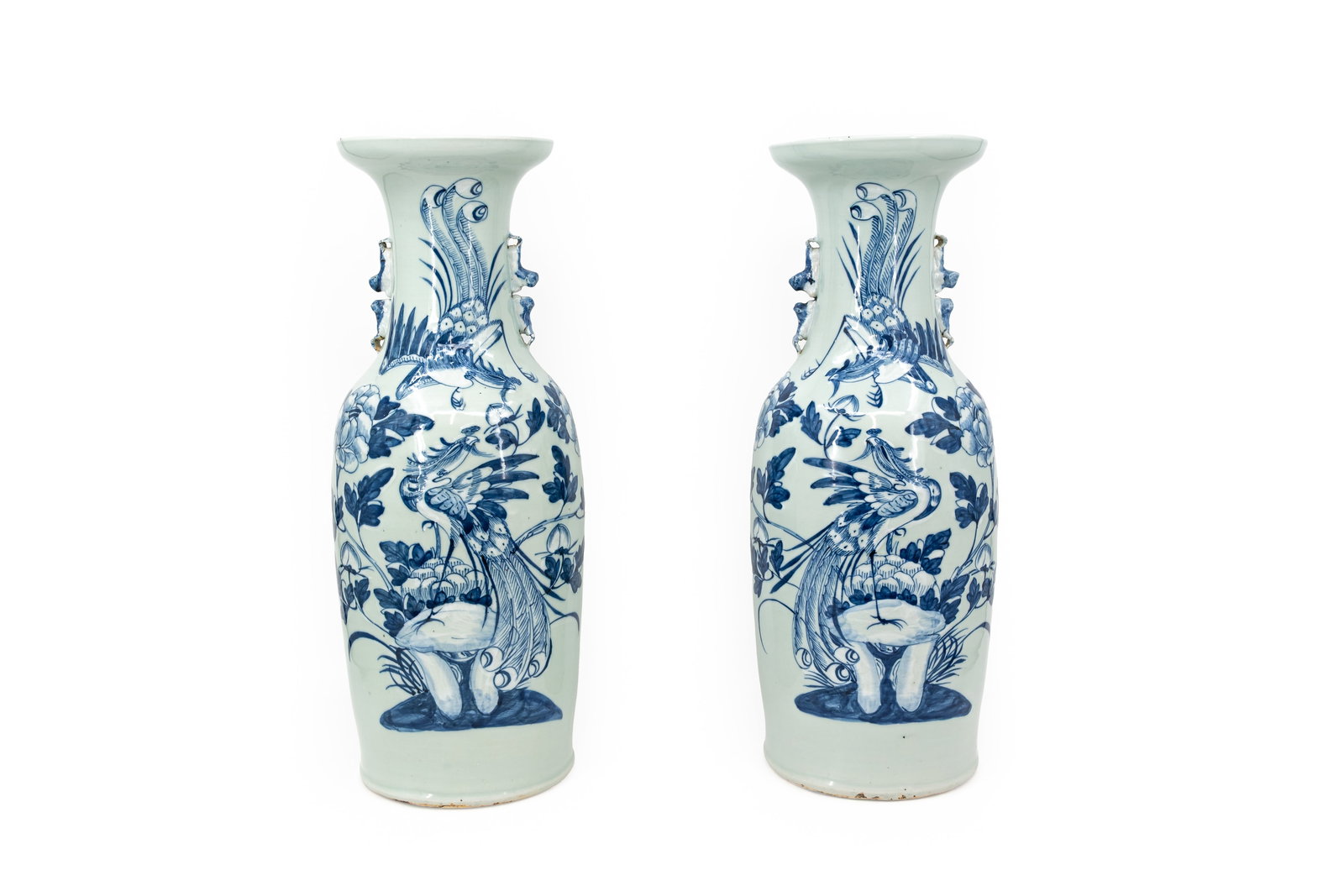 A pair of Chinese blue and white porcelain vases with phoenixes in nature: A pair of Chinese blue and white porcelain vases with phoenixes in nature. 19th/20th century. Condition: both vases are excellent. H: 58,5 cm