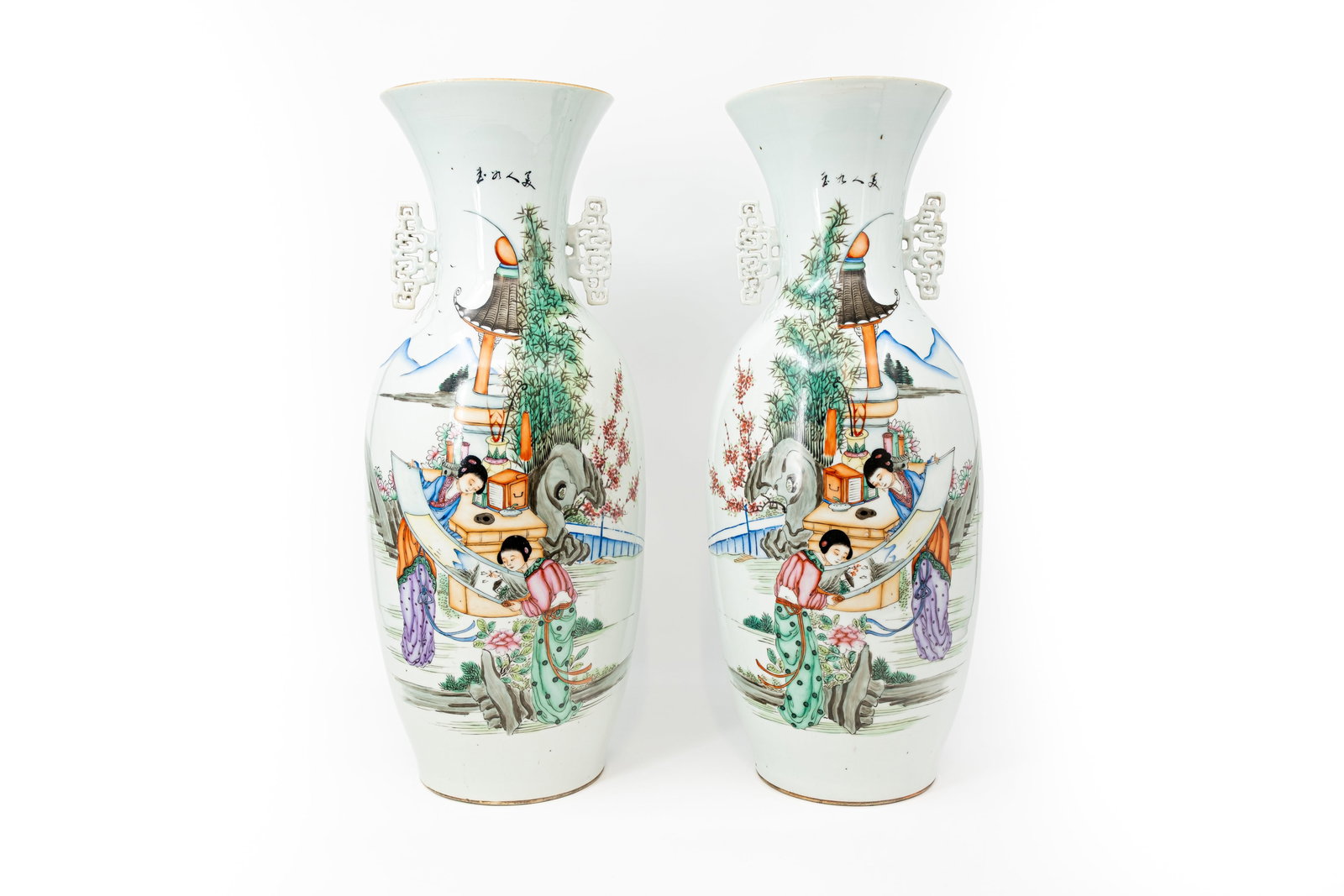 A pair of Chinese Famille rose finely decorated porcelain vases with the decor of ladies in the: A pair of Chinese Famille rose finely decorated porcelain vases with the decor of ladies in the garden. Rectangular shaped handles. 19th/20th century. Condition: both vases are excellent. H: 58,5 cm