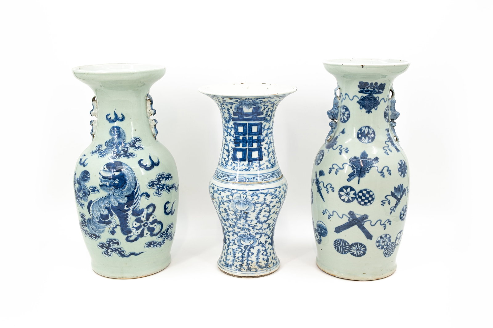 A composed lot of three Chinese blue and white porcelain variously decorated and shaped vases (1 of 13)