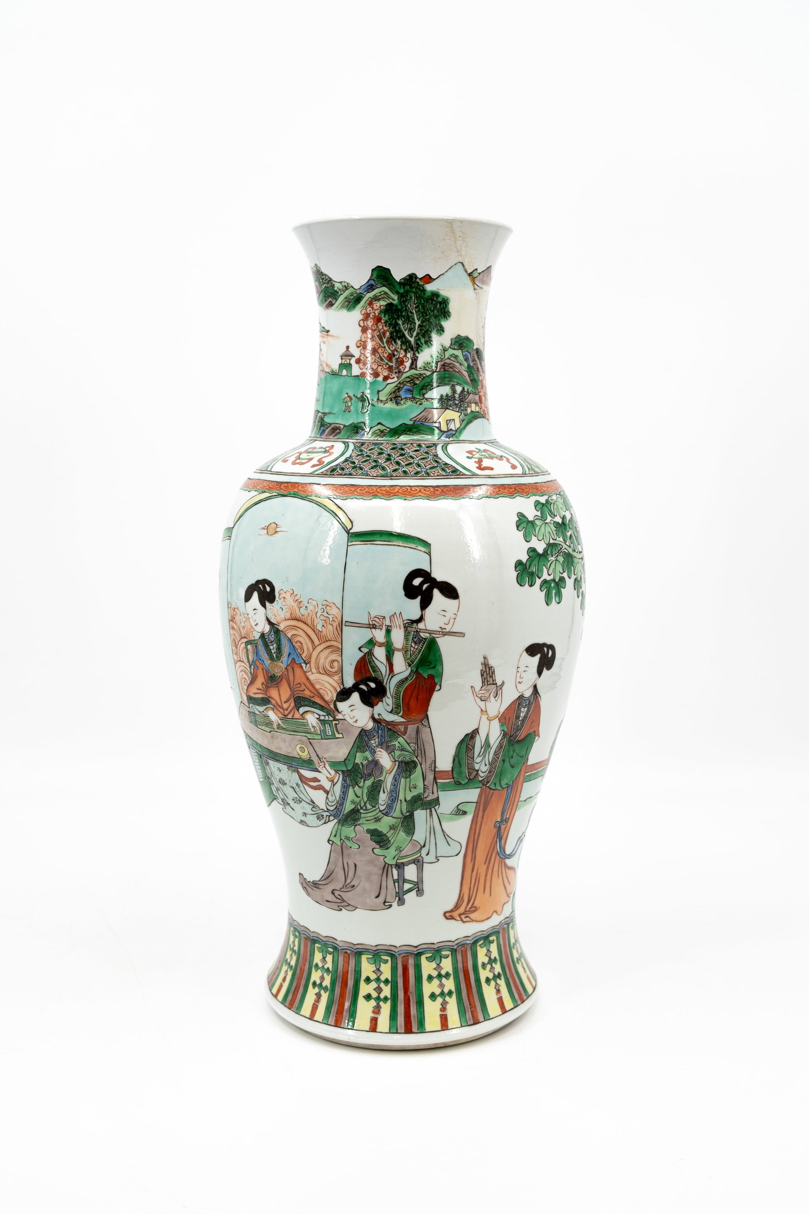 A Chinese Famille verte decorated porcelain vase with a figural scene of ladies: A Chinese Famille verte decorated porcelain vase with a figural scene of ladies. 19th century. Condition: old restoration on top, otherwise vase is excellent, report available on request. H: 48 cm