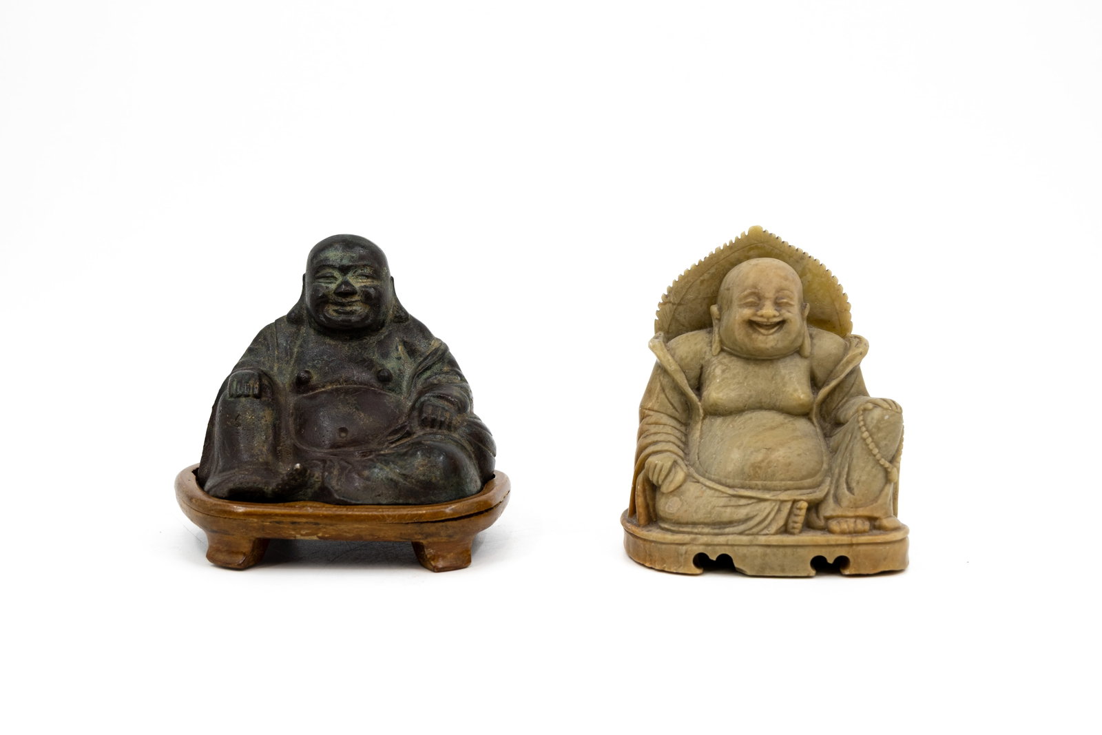 A composed lot of two Chinese patinated bronze and carved soapstone figures of sitting Buddha (1 of 12)