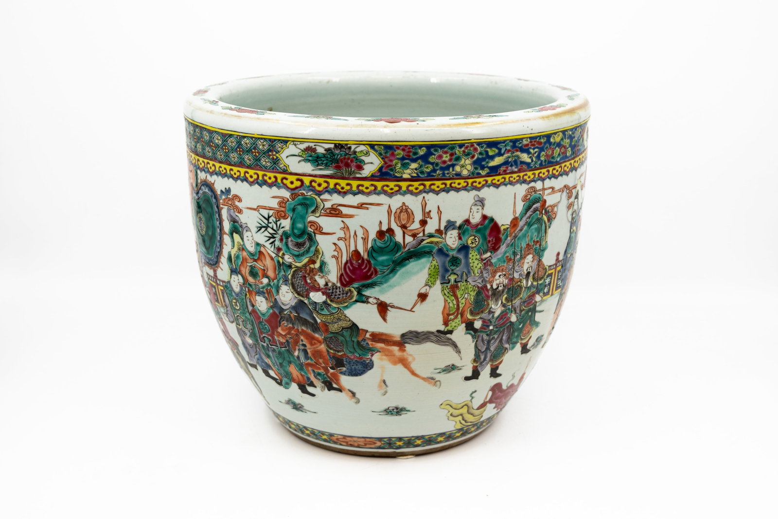 A large Chinese Famille rose with warriors decorated porcelain fish bowl: A large Chinese Famille rose with warriors decorated porcelain fish bowl. 19th/20th century. Condition: crow foot shaped crack on the inside and bottom crack, otherwise bowl is excellent. Report avail
