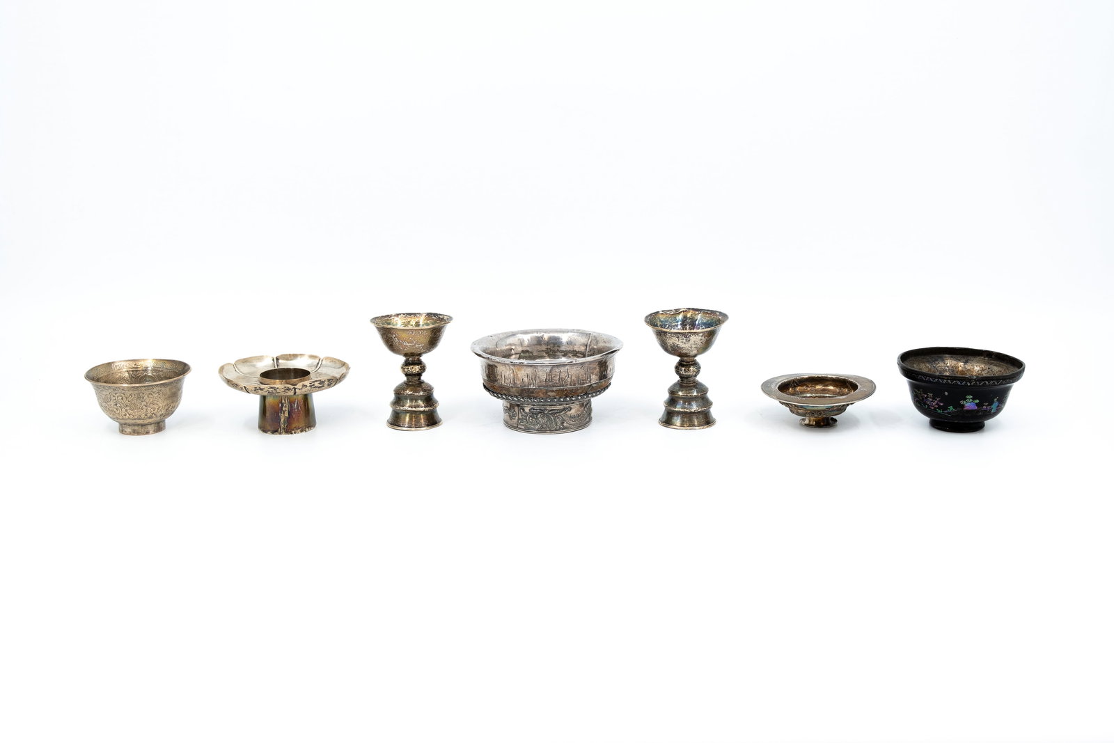 A composed lot of six Chinese and Tibetan silver and silver mounted objects (1 of 14)