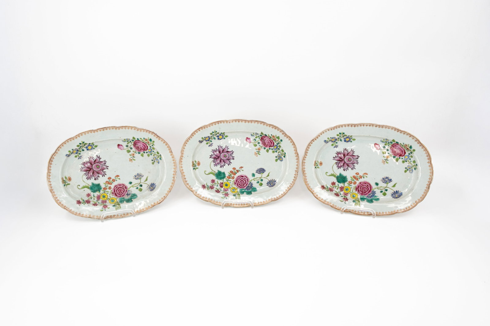 A matching lot of three Chinese Famille rose floral decorated oval shaped porcelain dishes (1 of 8)