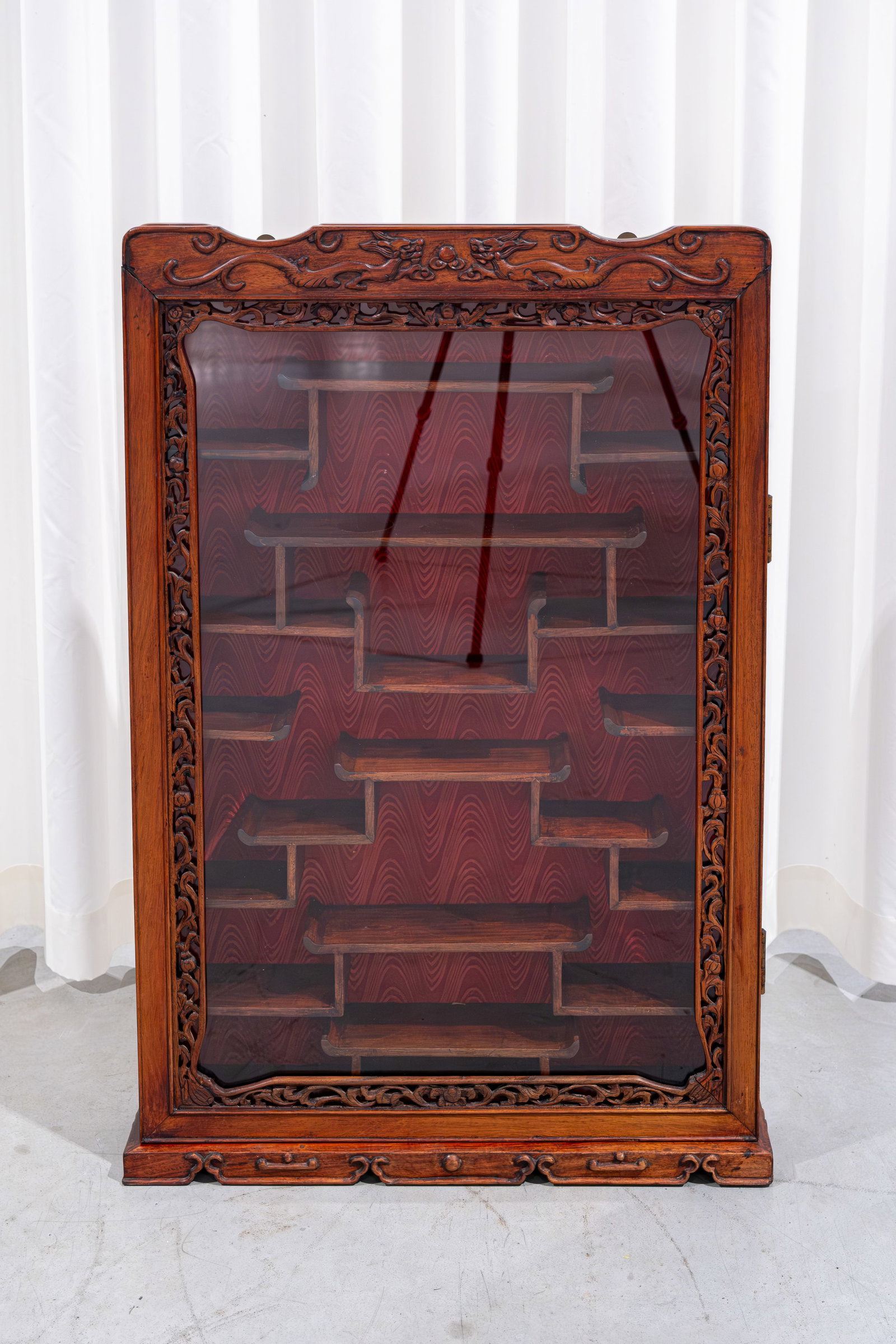 A Chinese carved exotic hardwood wall display cabinet (1 of 7)