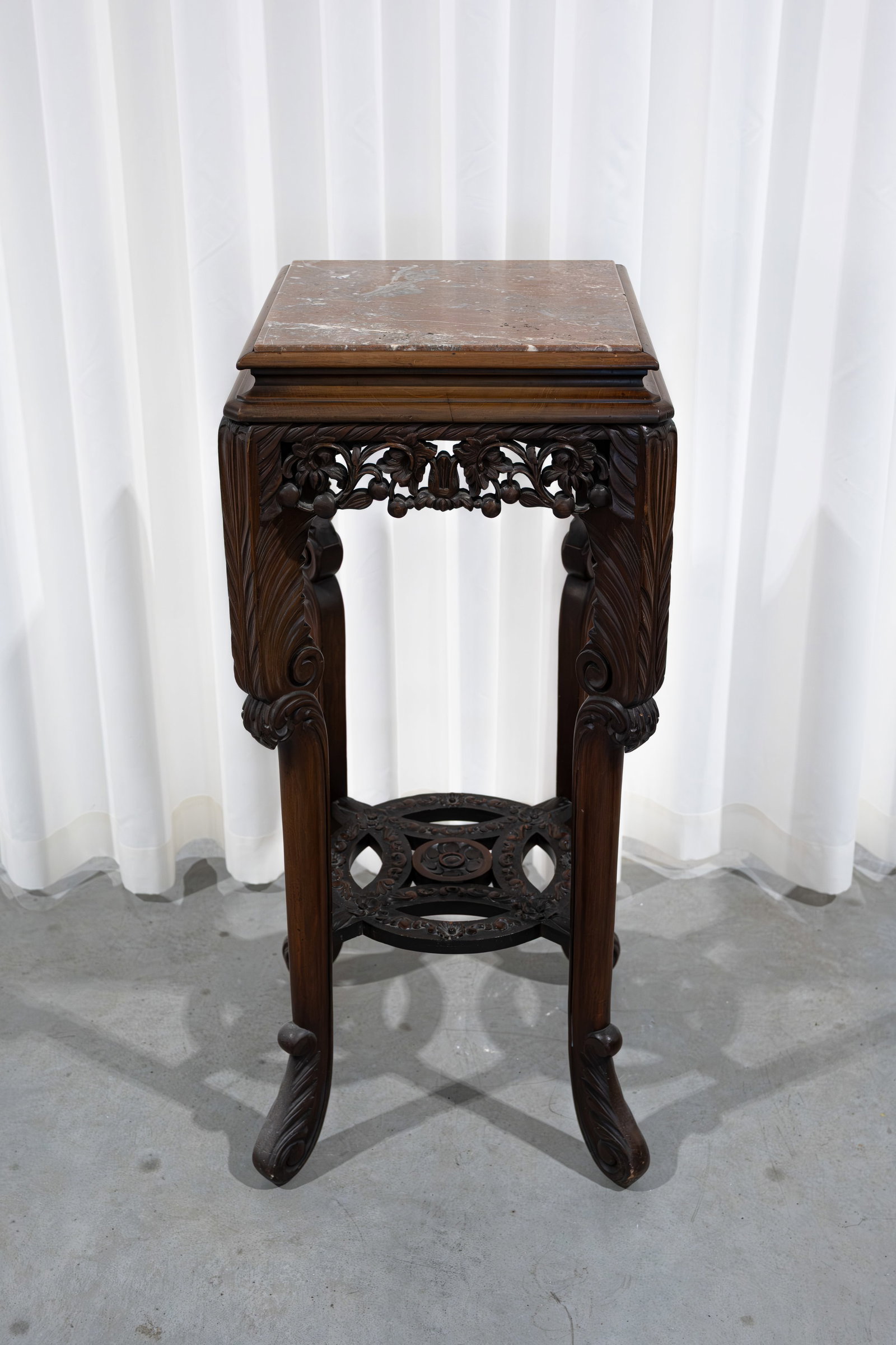 An oriëntal square carved wooden decorated pedestal with a marble top (1 of 9)
