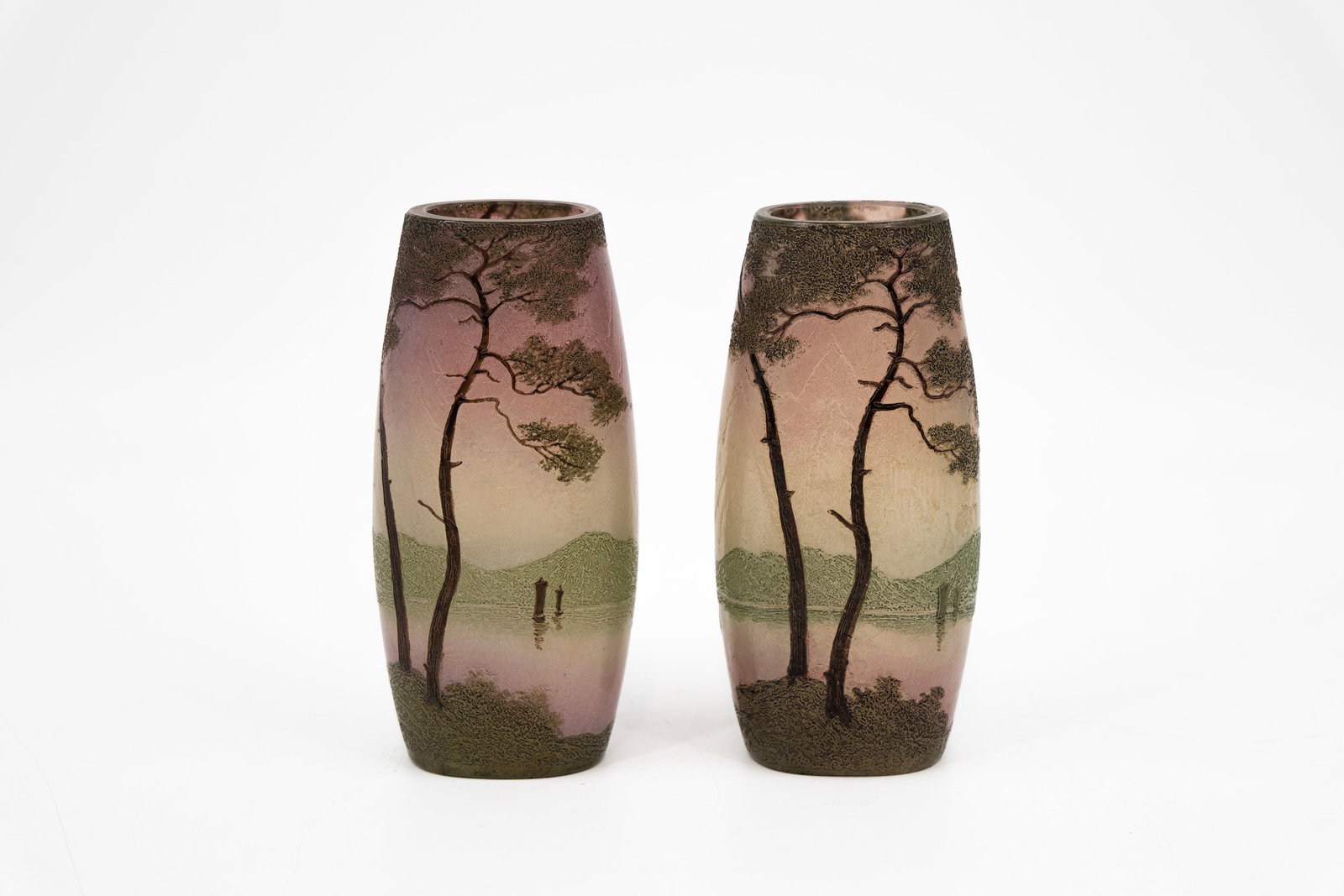 A matching pair of French art nouveau Legras cameo glass vases: A matching pair of French art nouveau Legras cameo glass vases decorated with a landscape with trees and a lake. Marked, first half of the 20th century. H: 15,3 cm