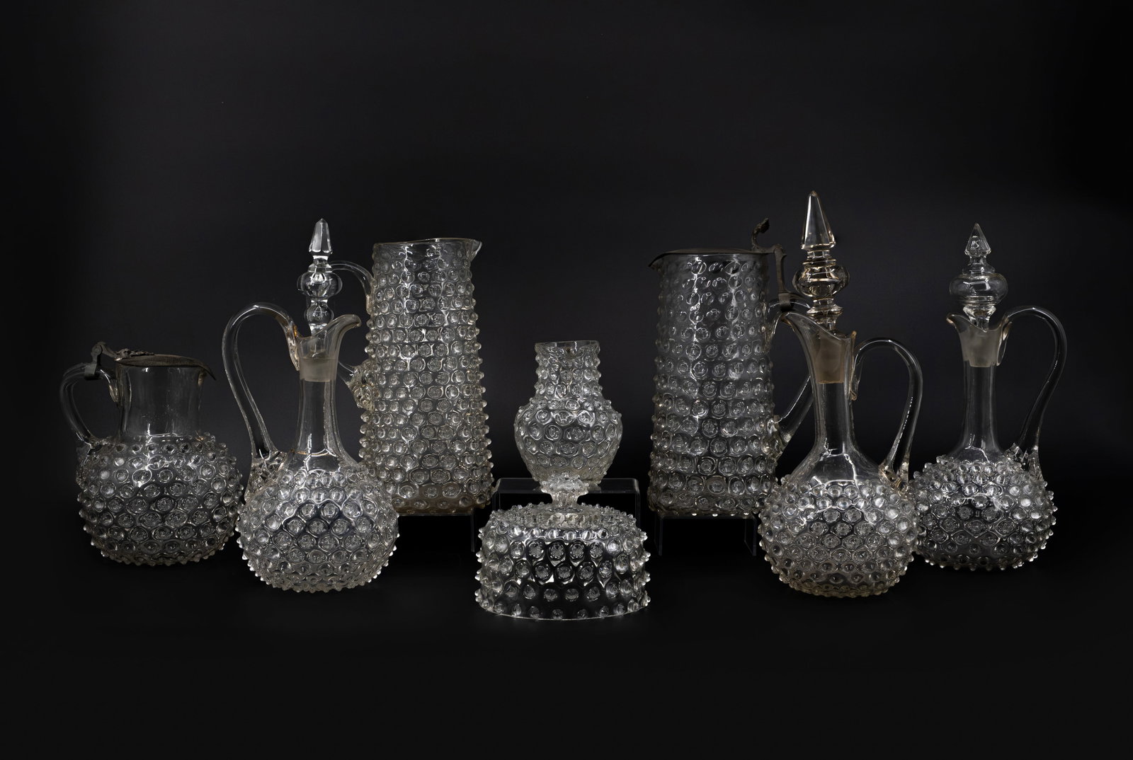 A composed lot of eight antique clear studded glass decanters, jugs and other tableware (1 of 19)