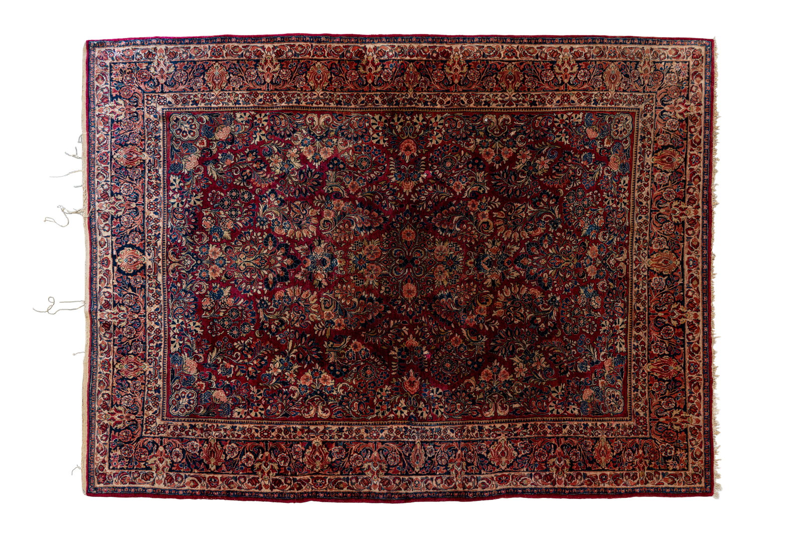 A large and antique hand-knotted Persian wool rug: A large and antique hand-knotted Persian wool rug decorated with an all-over floral design. Iran, probably Kashan, early 20th century. L: 350 - W: 258 cm