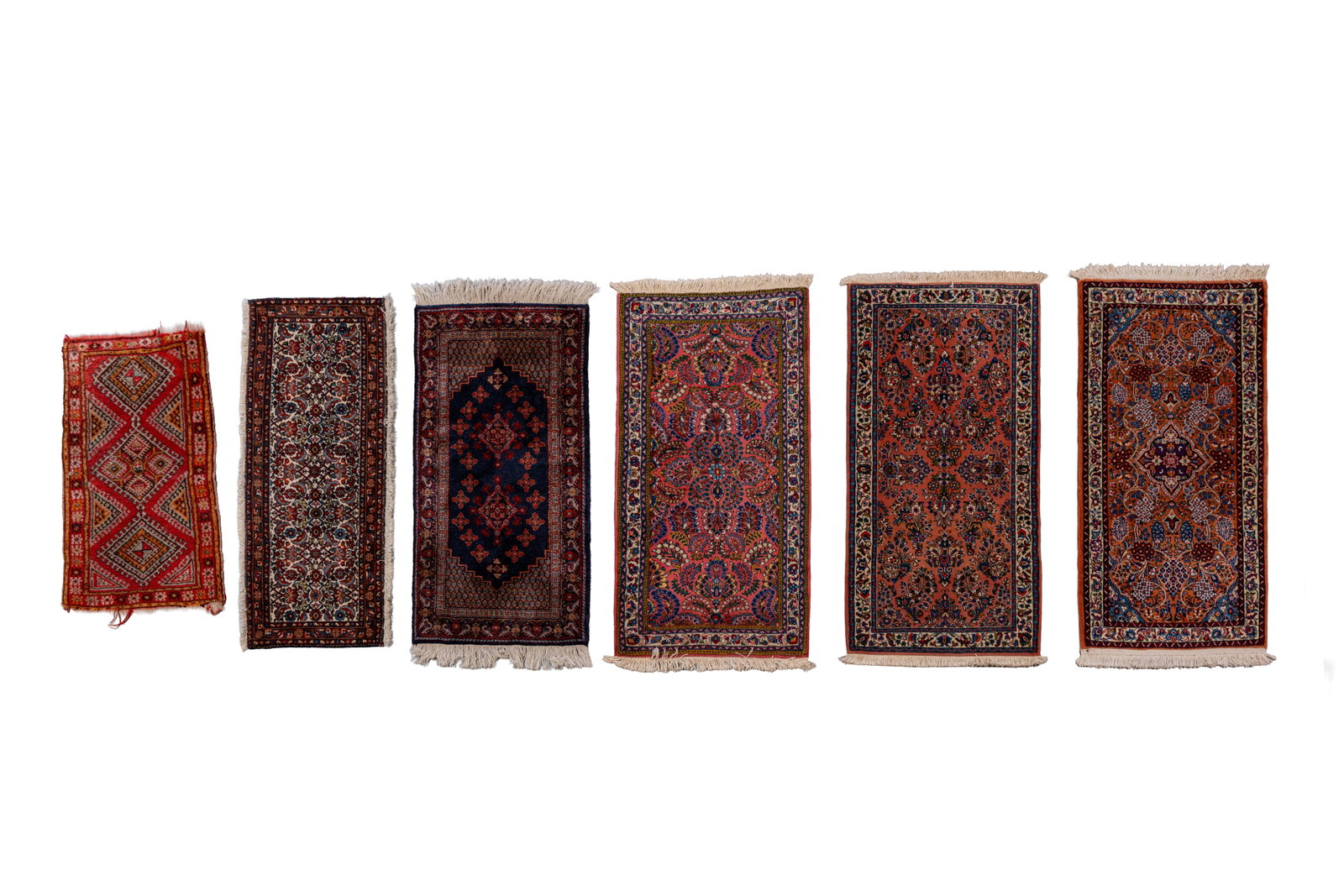 A lot of six small hand-knotted Oriental wool rugs, variously decorated (1 of 19)