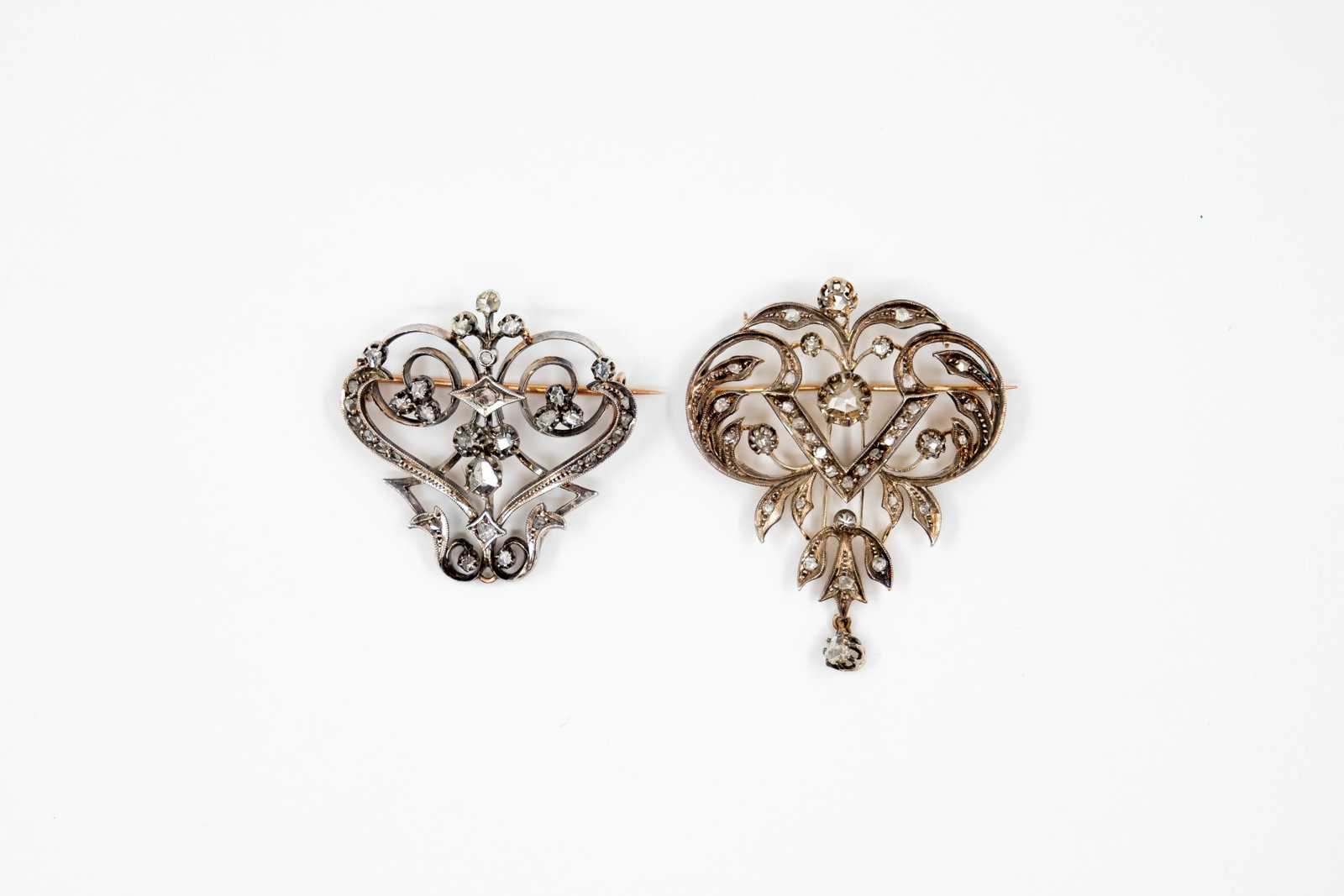 A lot of two antique old cut diamond 14k gold and silver pendant-broche: A lot of two antique old cut diamond 14k gold and silver pendant-broche set with rose-cut diamonds. Circa 1900-1920s. Total weight: 21,7g
