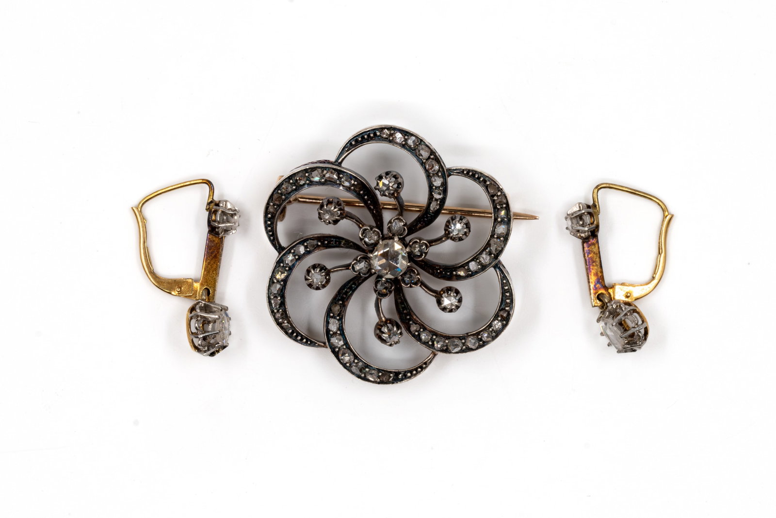 A 18k gold and silver diamond brooch together with a pair of 18k gold diamond pendant earrings (1 of 4)