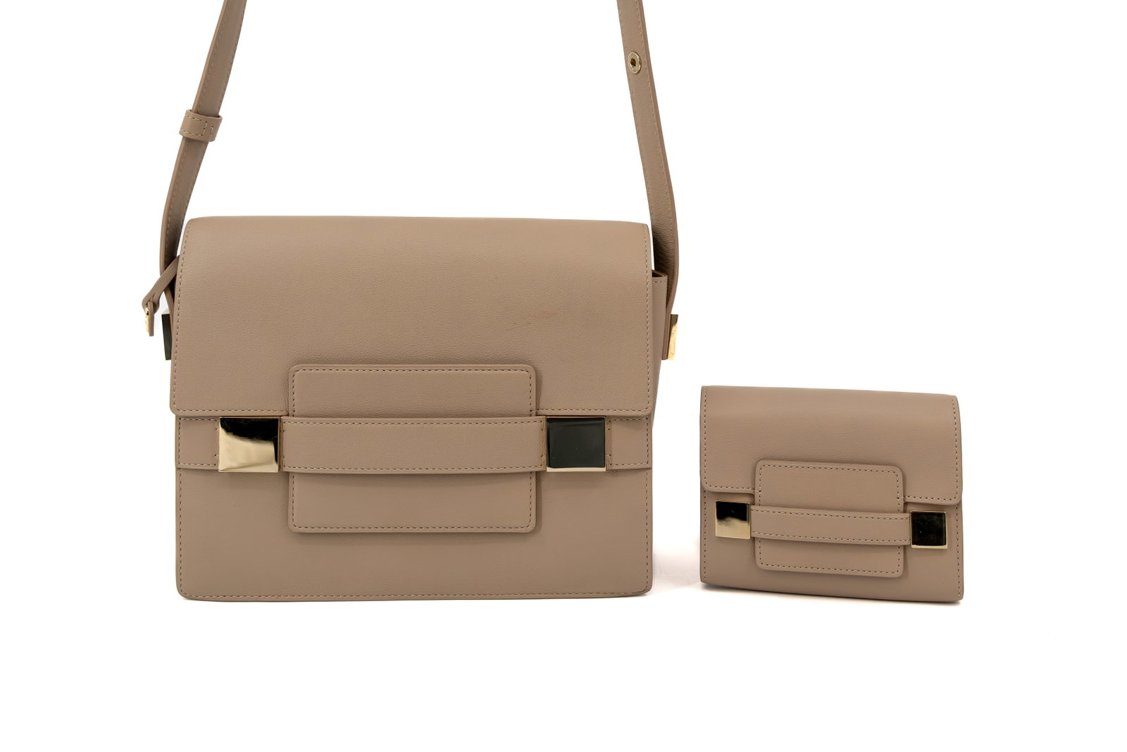 A Delvaux crossbody bag model Madame and its matching wallet: A Delvaux crossbody bag model Madame and its matching Madame wallet in sand polo leather and gold-toned hardware. The strap is adjustable. Comes with a vanity mirror and both dustbags and certificates