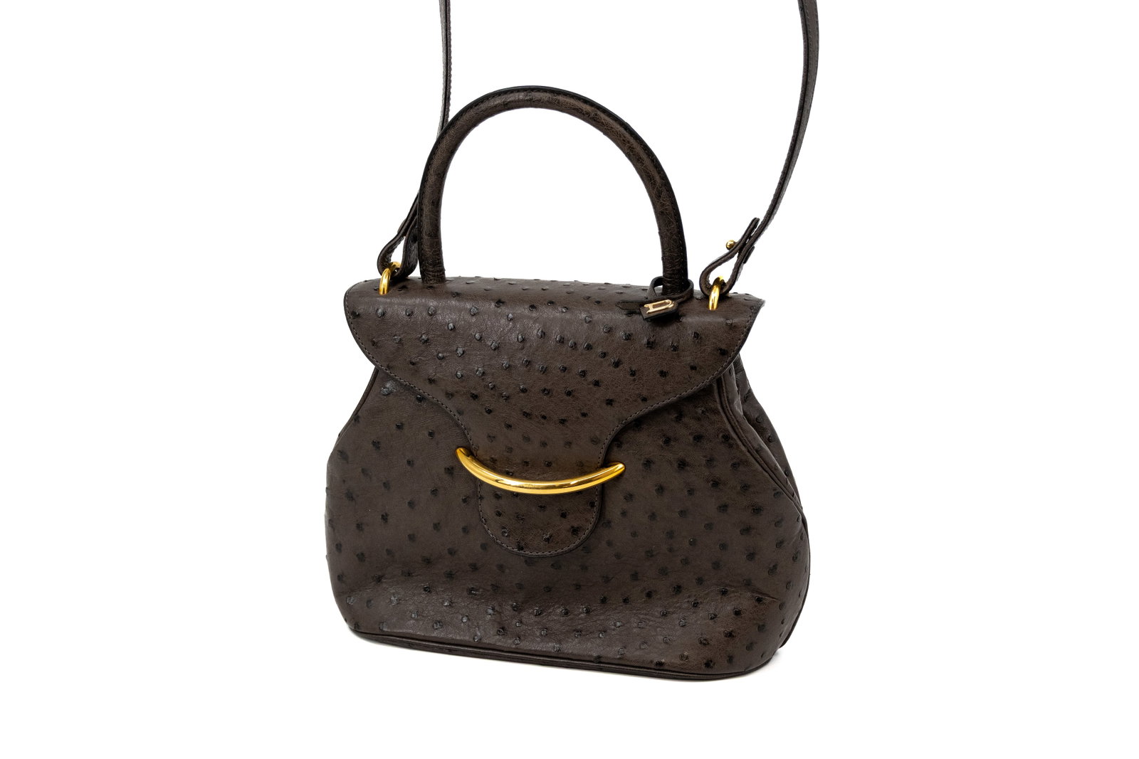 A Delvaux handbag model Baltimore in grey-brown ostrich leather: A Delvaux handbag model Baltimore in grey-brown ostrich leather. Comes with its vanity mirror and dustbag. Condition: excellent condition with no traces of usage except for a water stain/discoloration
