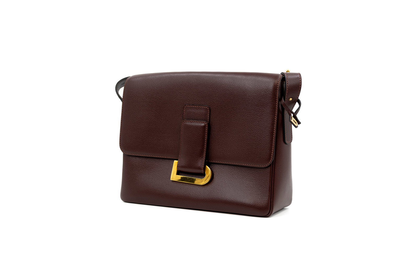 A Delvaux crossbody bag model Poirier in Ravello calf leather: A Delvaux crossbody bag model Poirier in Ravello calf leather with gold-toned hardware. Comes with its vanity mirror and Delvaux dustbag. Condition: this bag is in very good condition and only shows b