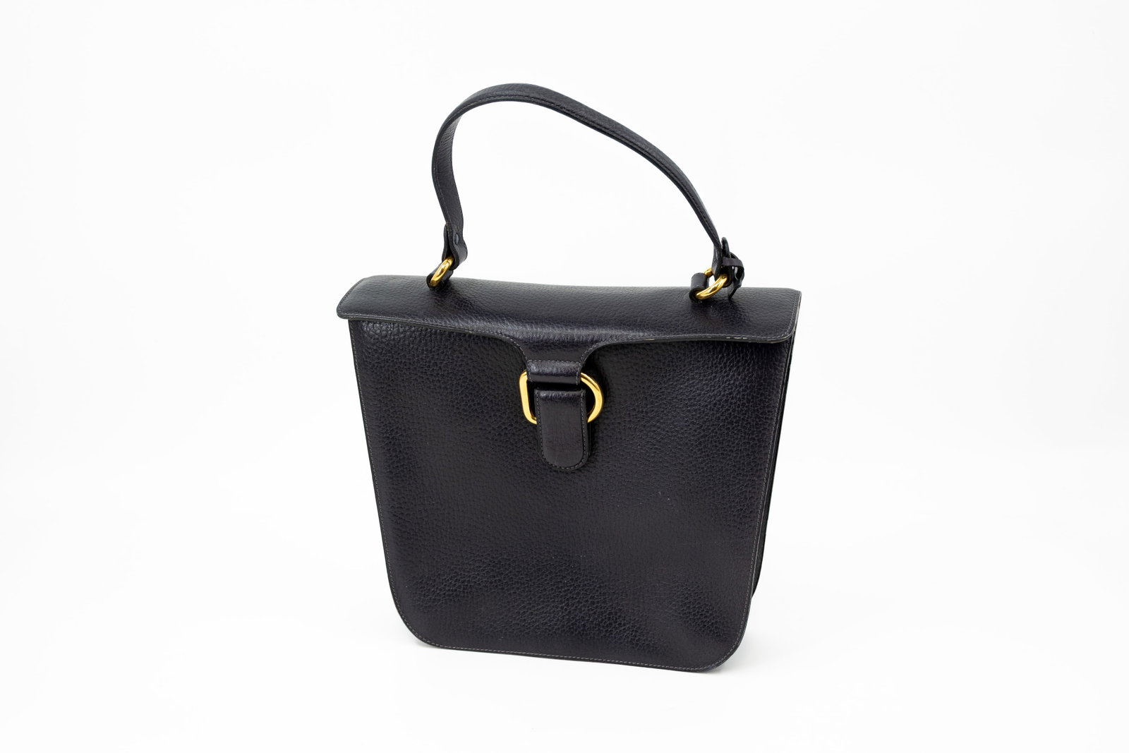 A vintage Delvaux top-handle bag in navy blue leather: A vintage Delvaux top-handle bag in navy blue leather. Condition: very good condition with some very slight scratches on the edges, very neat interior and no tarnishing on any hardware. H: 26 - W: 30 
