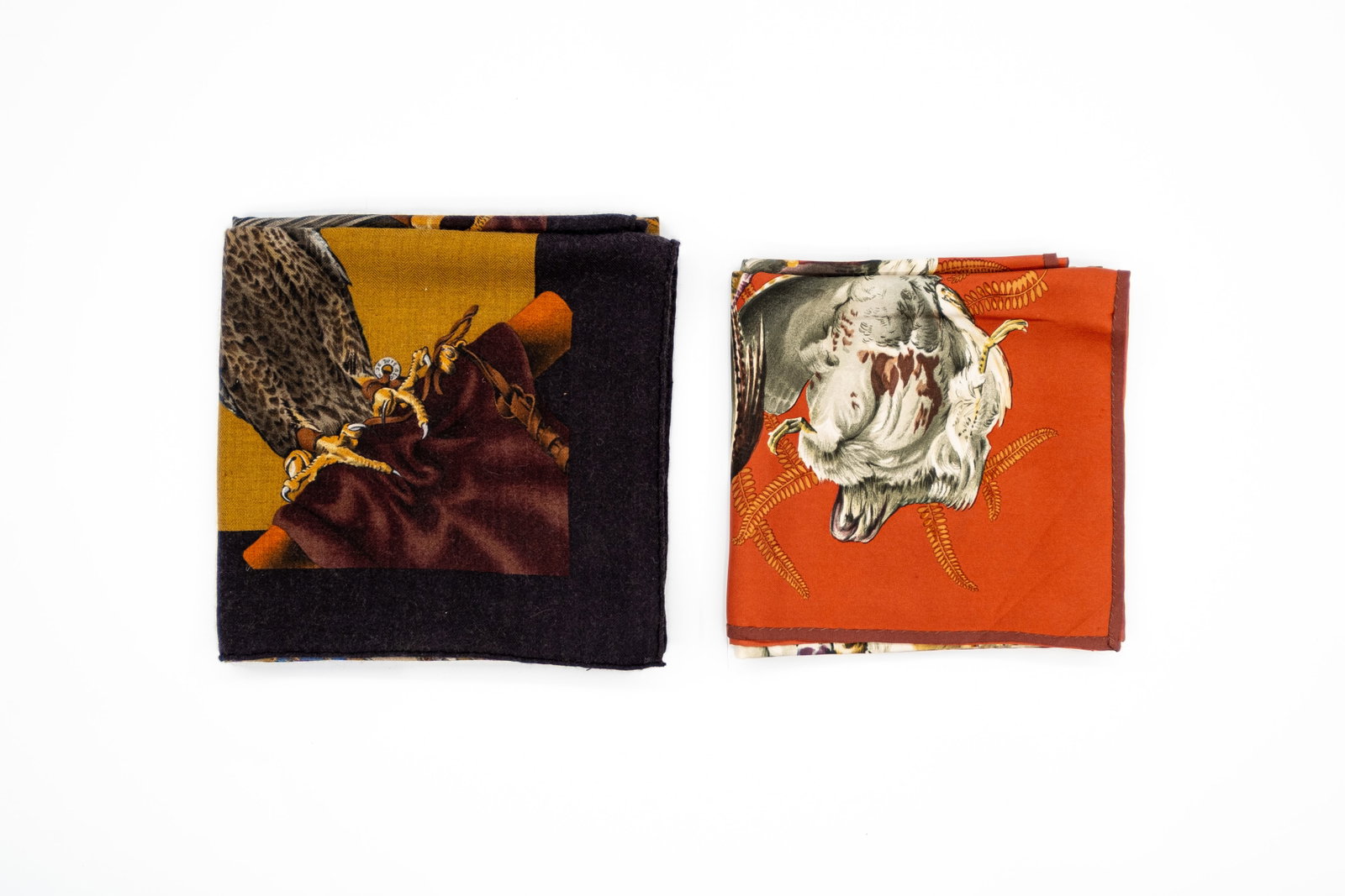 A composed lot of two Classic Carré Hermes scarves. both designed by Henri De Linares.: Lot 250. A composed lot of two Classic Carré Hermes scarves. Design "Gibiers" in silk and "Chasse a Vol" in a silk and cashmere blend, both designed by Henri De Linares. Condition: "Gibiers" seems to