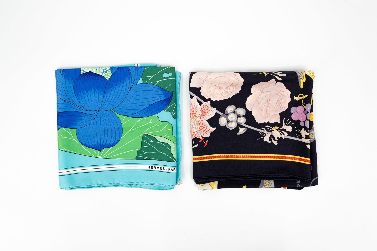 A composed lot of two Classic Carré Hermes scarves, both designed by Christiane Vauzelles: Lot 251. A composed lot of two Classic Carré Hermes scarves. Design "Fleurs et Raisins" and "Fleurs de Lotus", both designed by Christiane Vauzelles. Condition: "Fleurs et Raisins" comes in its origi