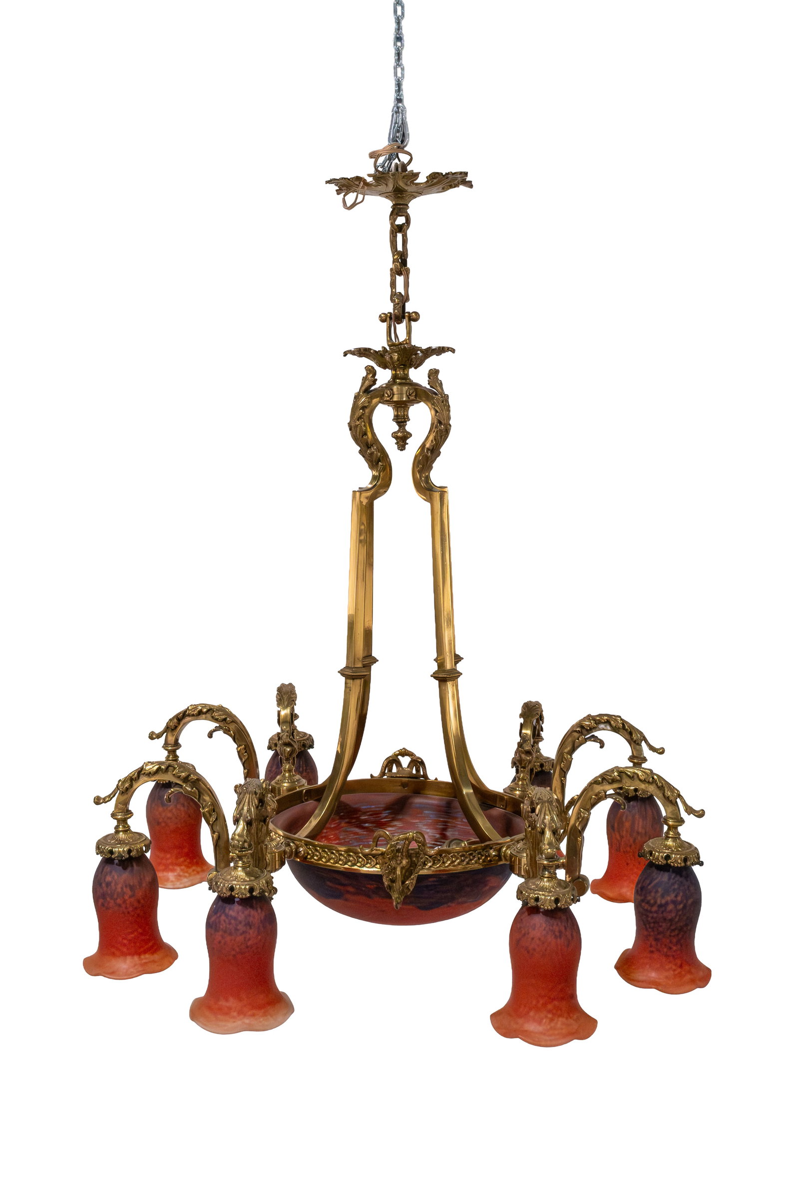 An antique French, brass decorated and glass mounted chandelier: An antique French, brass decorated and glass mounted chandelier. Illegible signed in the glass, Nancy. Circa 1900. H: 100 cm