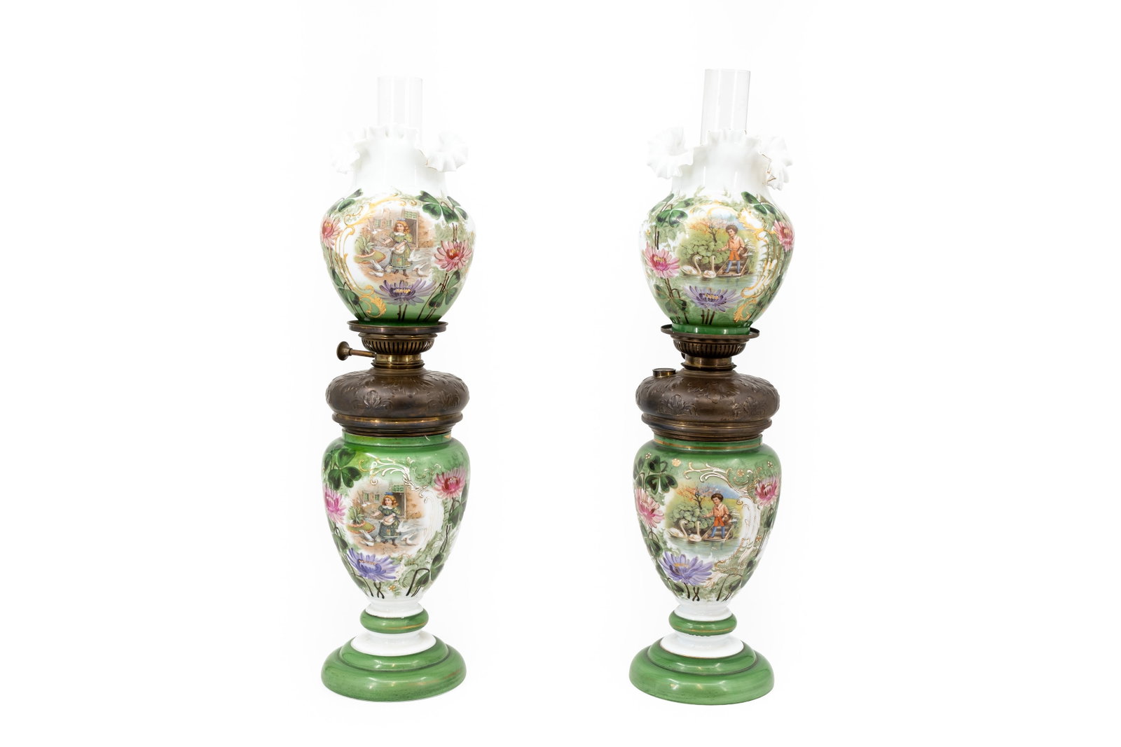 An antique pair of green and figural decorated opaline glass oil lamps: An antique pair of green and figural decorated opaline glass oil lamps. Circa 1900. H: 67 cm, total