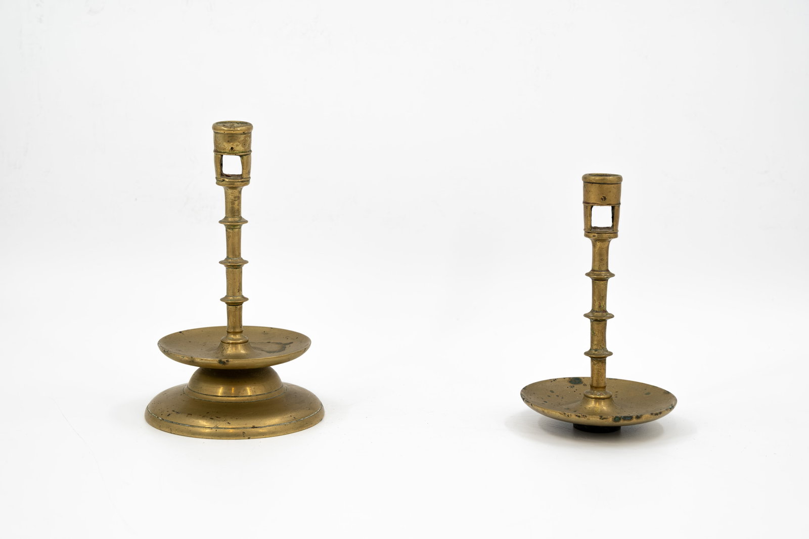 A composed lot of two antique and probably Flemish Gothic cast bronze knot candle holders (1 of 5)