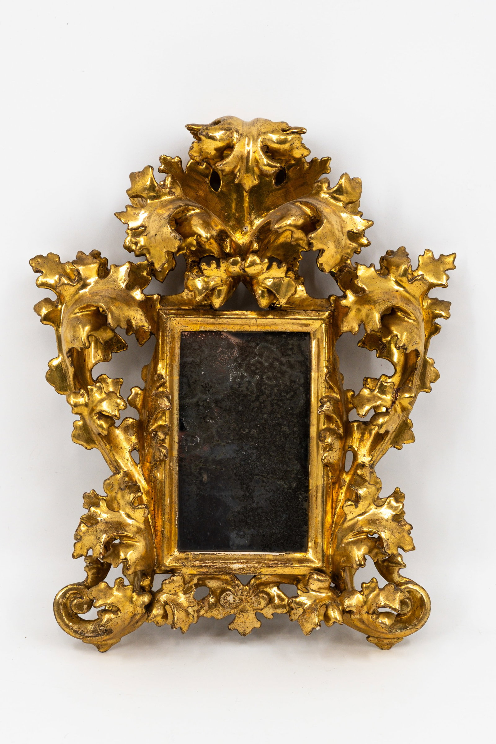 An antique Italian rococo style gilt carved wooden mirror (1 of 7)