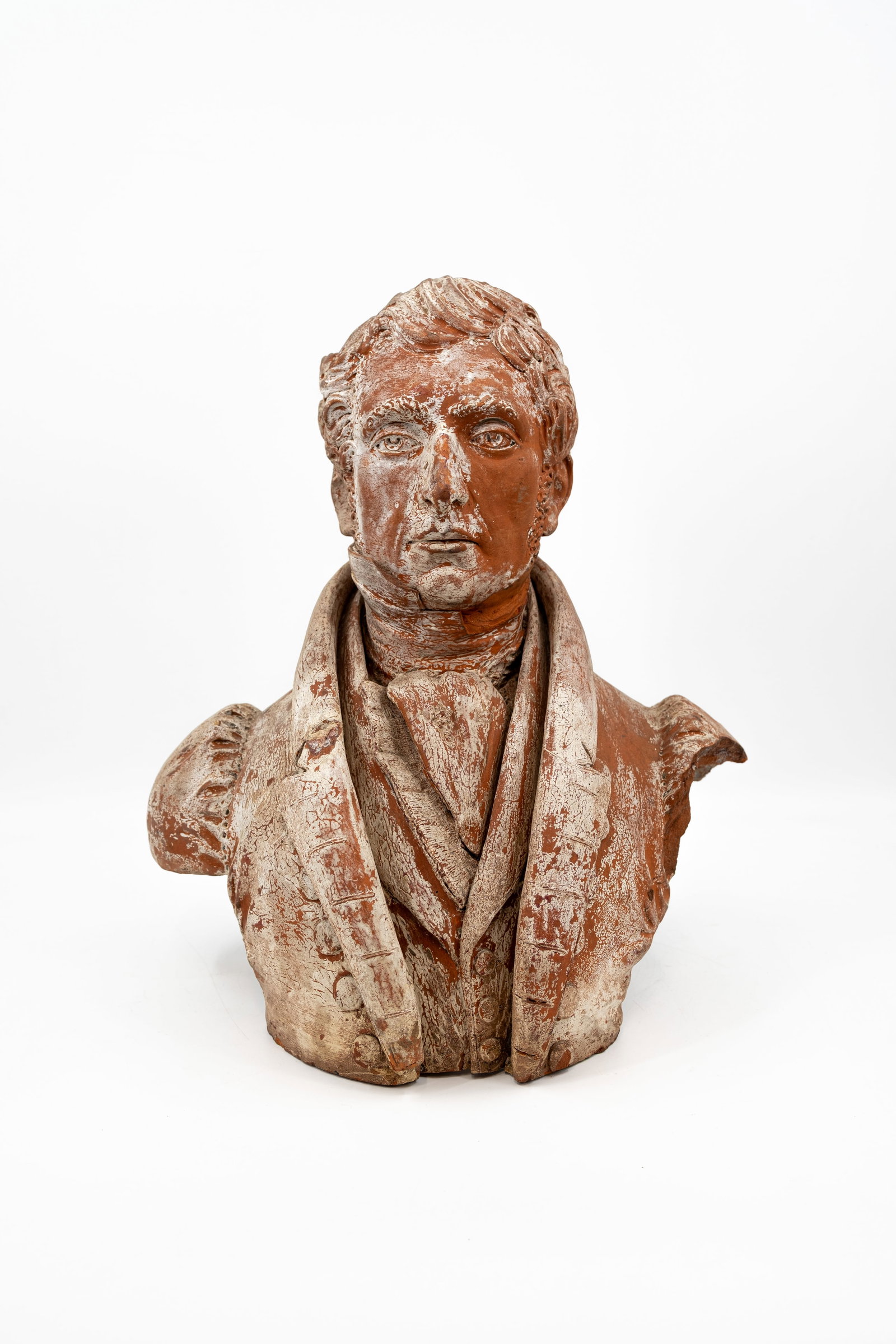 An antique terracotta figural bust of a posing man: An antique terra cotta figural bust of a posing man. Unsigned, 18th/19th century. H: 50 cm