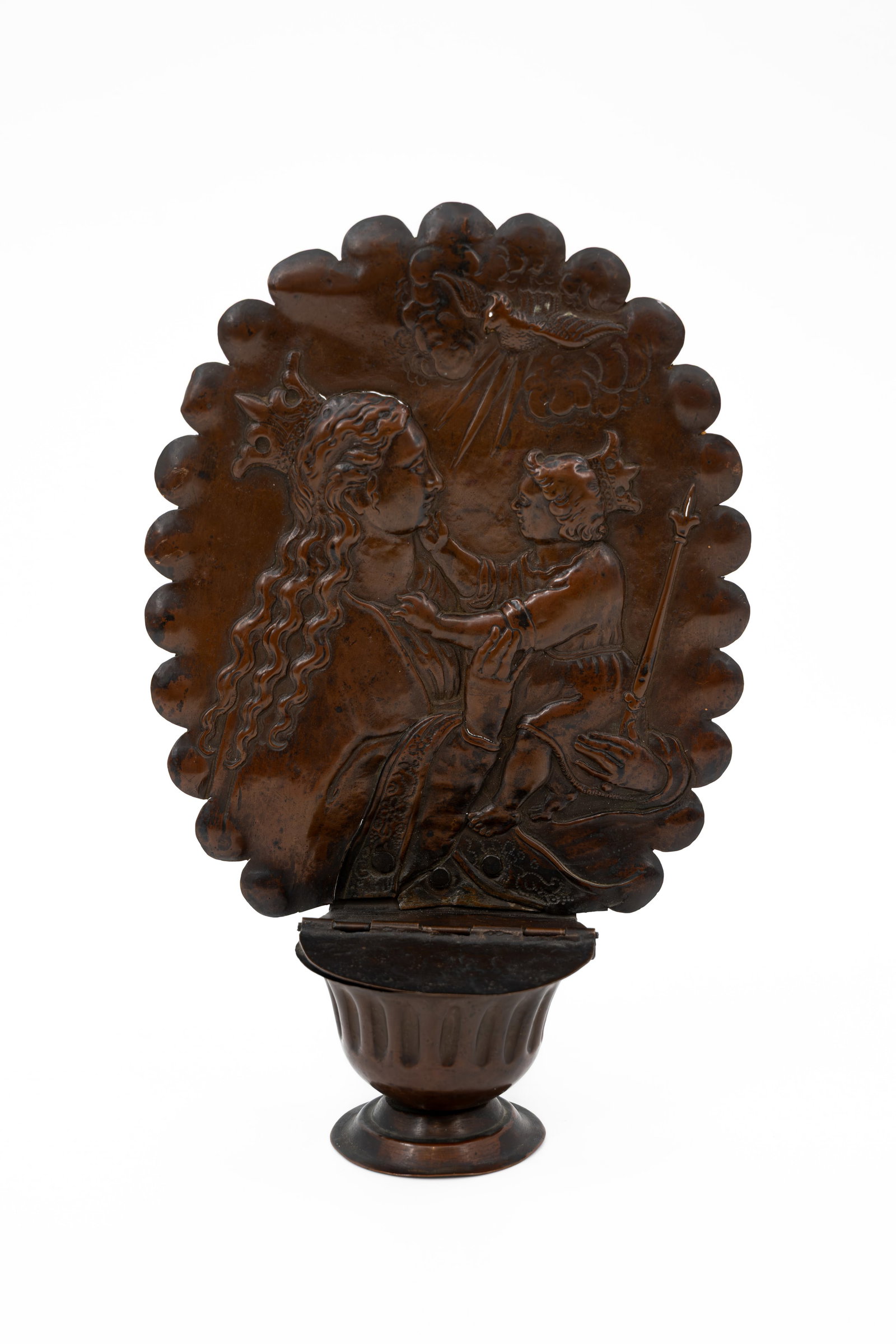 An antique religious bas-reliëf decorated copper holy water font with scene of mother and child: An antique religious bas-reliëf decorated copper holy water font with a scene of mother and child. 18th/19th century. H: 27 cm