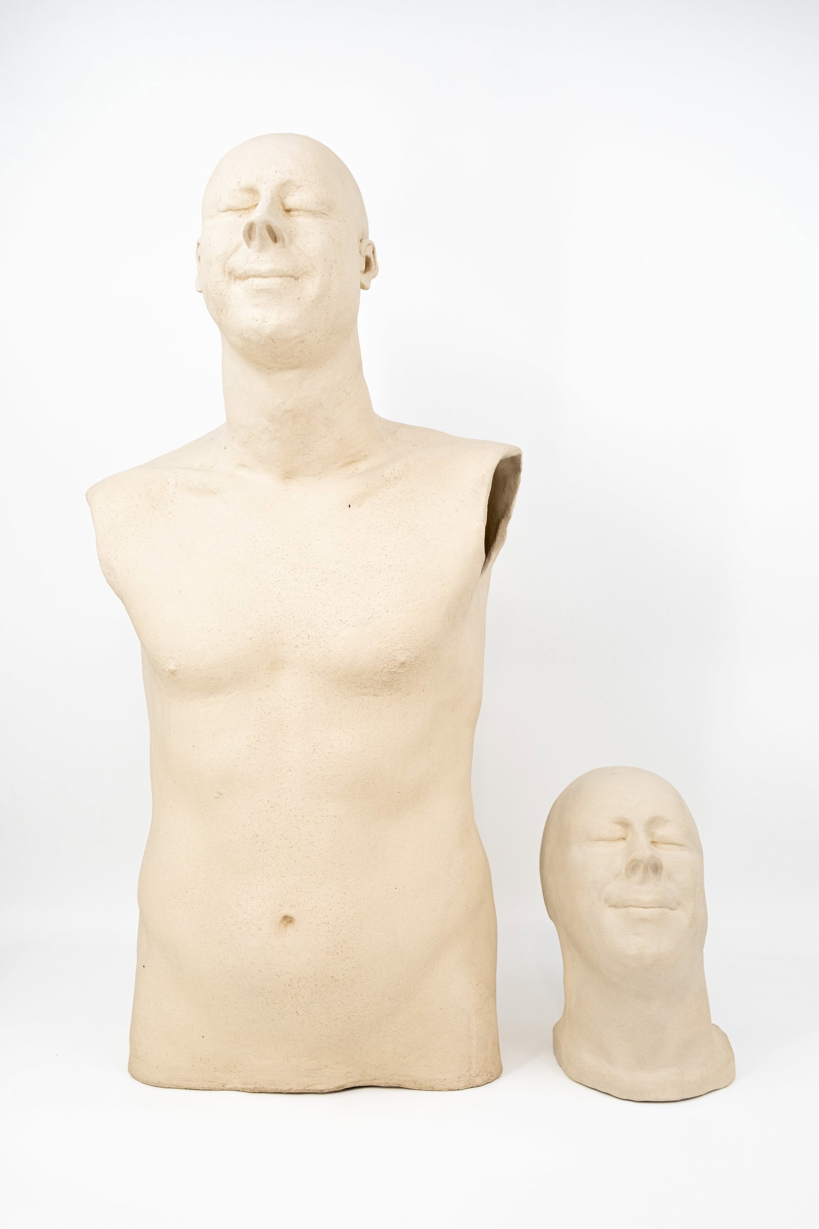 A composed lot of a patinated ceramic torso and a male head: A composed lot of a patinated ceramic torso and a matching male head. Monogram marked, 21th Century. H: 25 - 81 cm