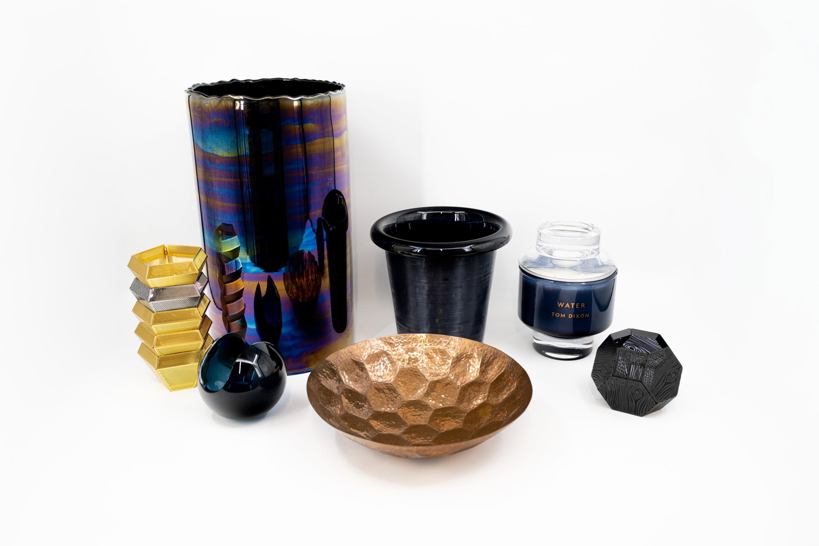 A collection of 11 various design objects by Tom DIXON: A collection of 11 various design objects designed by Tom DIXON. Consisting of: - six black, chomed, gilt metal candle holders. - one blue colored glass ice-bucket model Plum (with minor bottom chip).