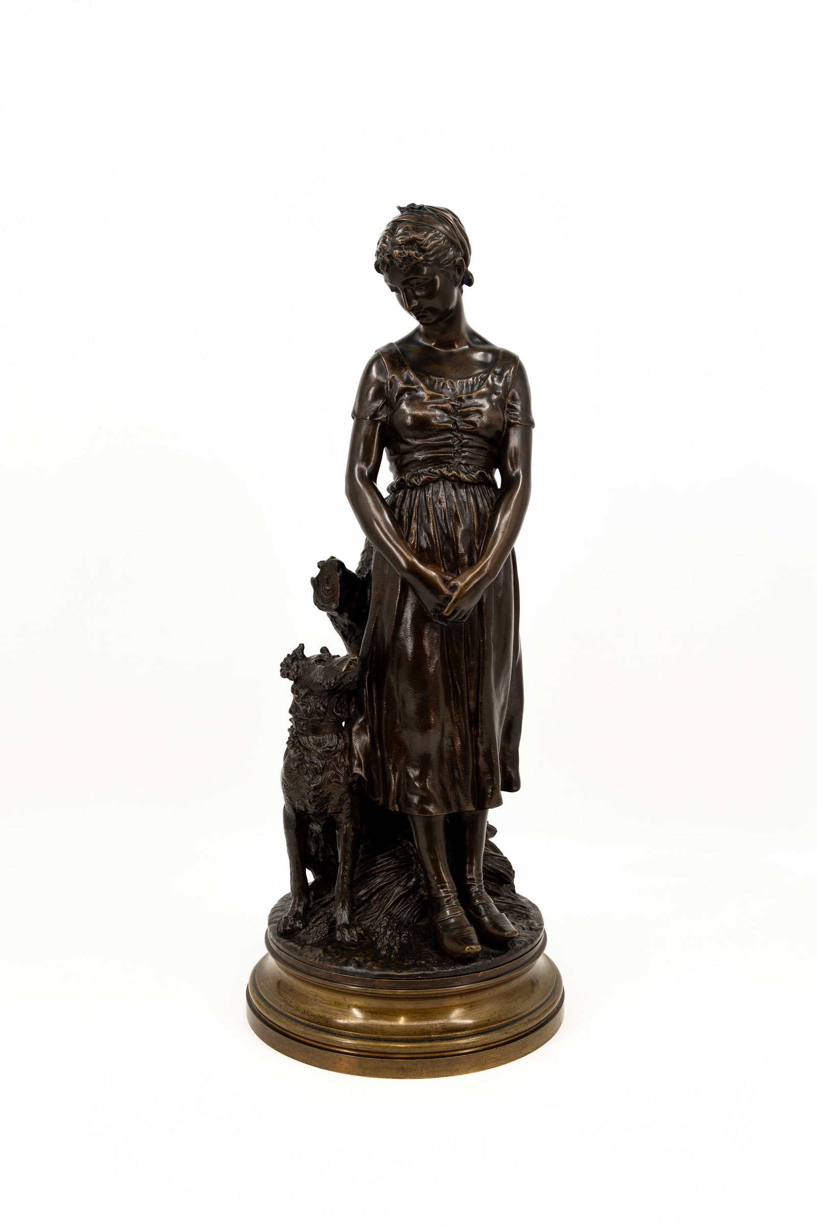 Emile-Louis TRUFFOT (1843-1895) A large antique patinated bronze sculpture: Emile-Louis TRUFFOT (1843-1895) An large antique patinated bronze sculpture representing of a young lady accompanied by a dog. Footed on a rotating base. Signed, 19th century. H: 65 cm, with base