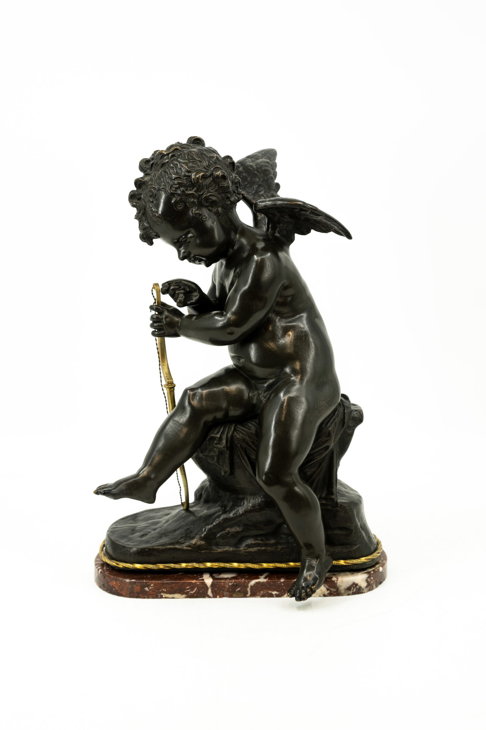 Charles Gabriel LEMIRE (1741-1827) An antique French patinated bronze sculpture: Charles Gabriel LEMIRE (1741-1827) An antique French patinated bronze sculpture of cupid. Footed on a red marble base. Signed on two places. 19th century. H: 40 - W: 24,5 cm, without base