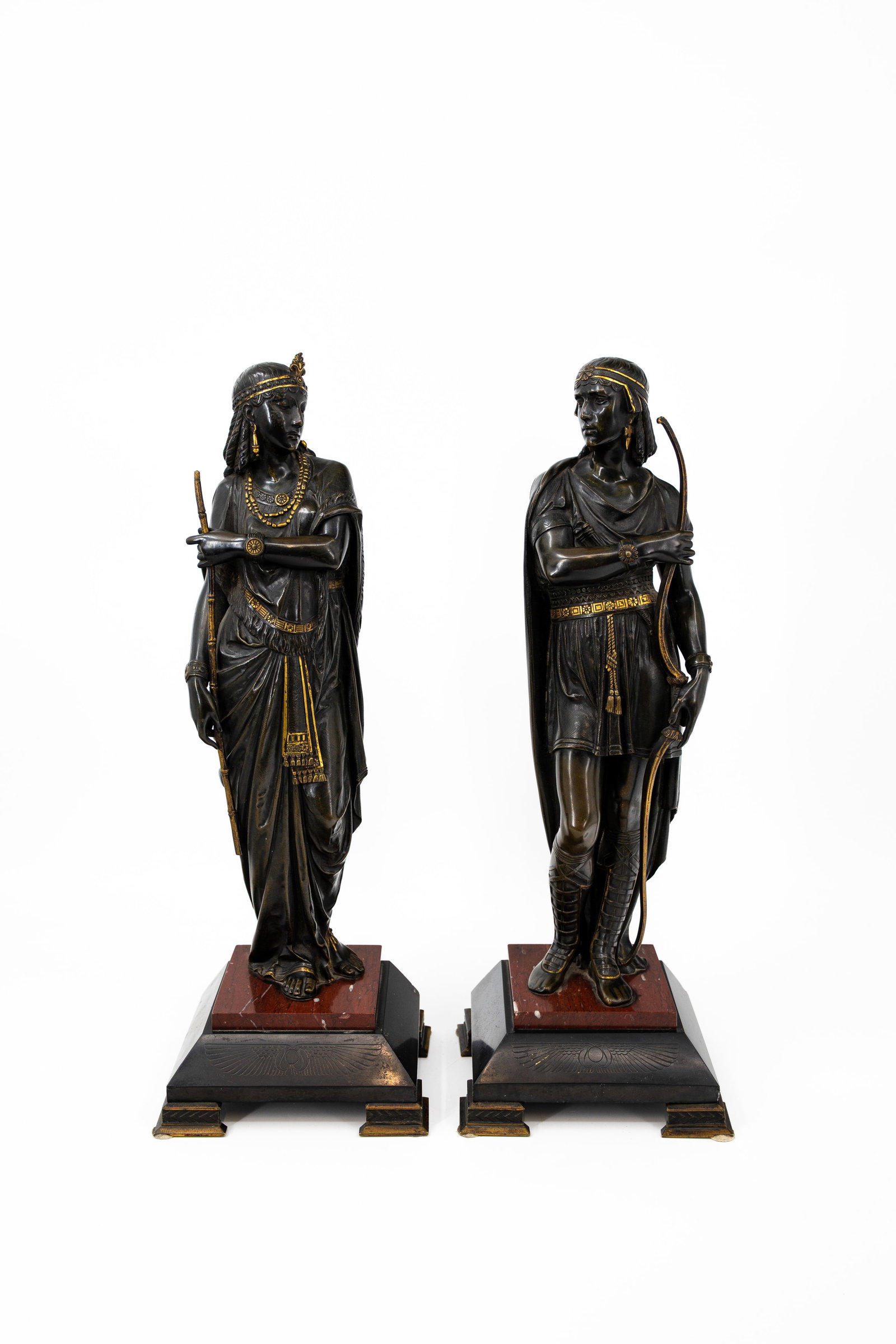 Emile PICAULT (1833-1915) attributed to. A pair of antique gilt and patinated bronze sculptures: Emile PICAULT (1833-1915) Attributed to. A pair of antique gilt and patinated bronze sculptures, "Retour d'Egypte". Mounted on a red and black marble decorated base. 19th century. H: 47 cm, with base