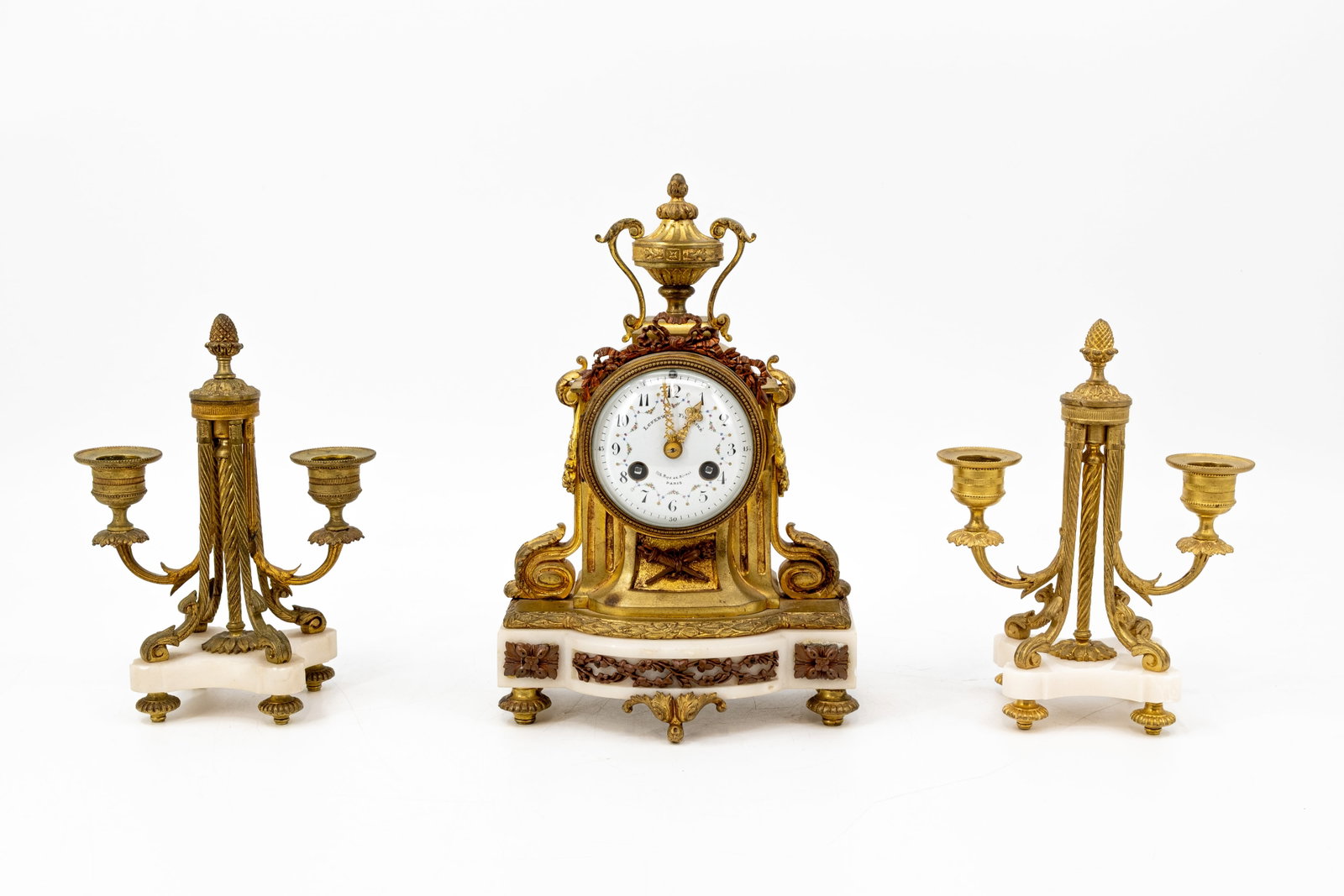 A matching Louis XVI style marble and gilt bronze mantel clock set: A matching Louis XVI style marble and gilt bronze mantel clock set. Marked: Lefebvre Fils Ainé. 106 Rue de Rivoli Paris. 19th century. H: 27,5 - W: 18 cm, clock