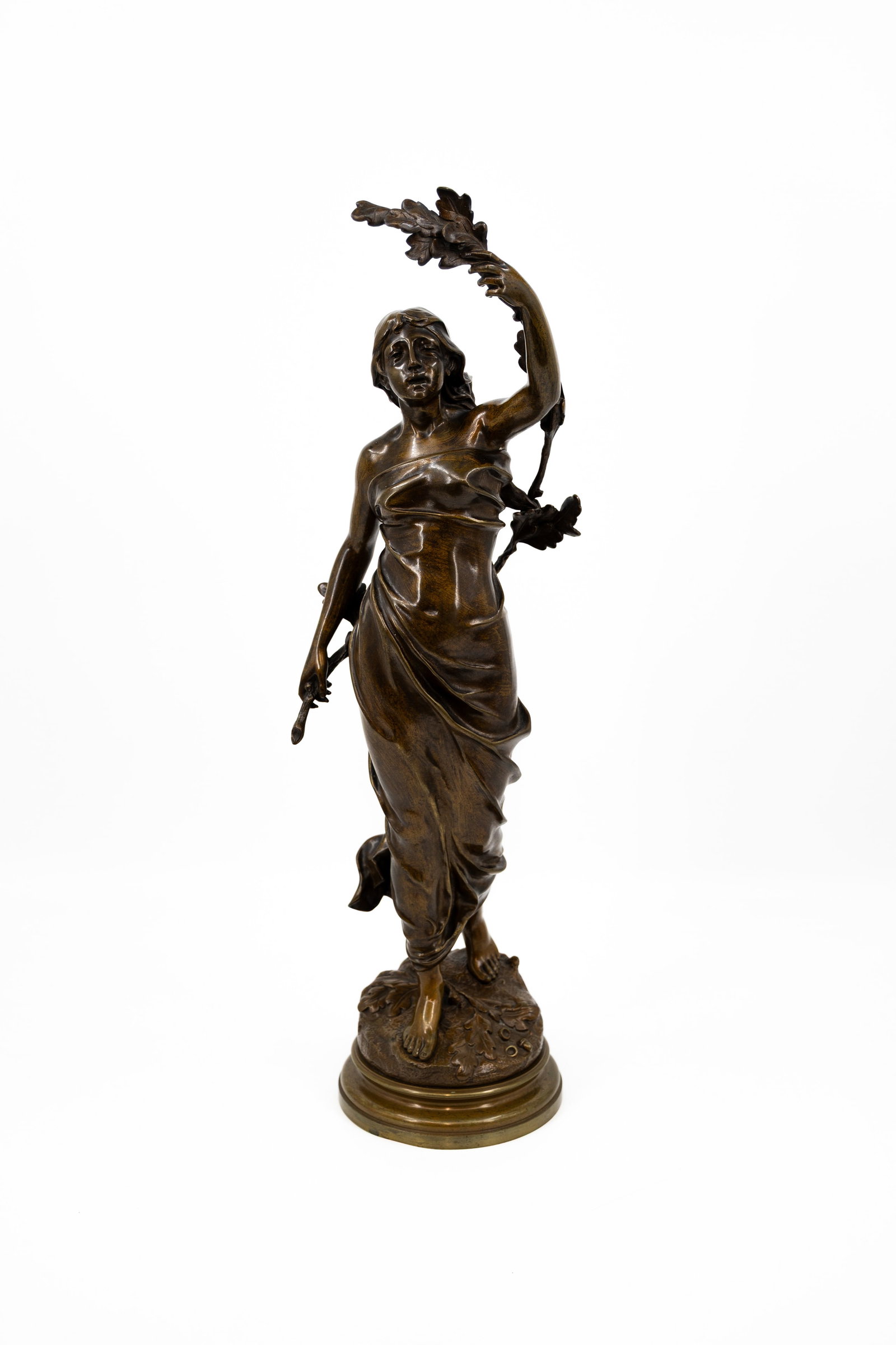 Léon BUREAU (1866-1906) A large antique patinated bronze sculpture: Léon BUREAU (1866-1906) An large antique patinated bronze sculpture representing an elegant lady holding a branch. Signed, late 19th century. H: 65 cm