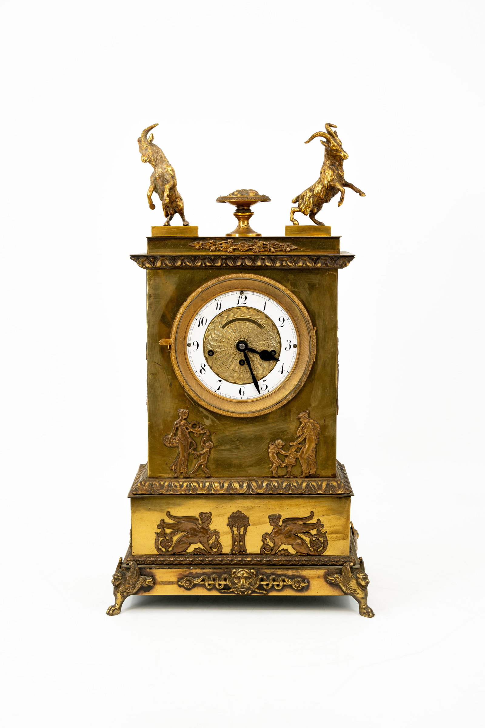 An antique Empire style gilt bronze table clock decorated with rearing goats (1 of 9)