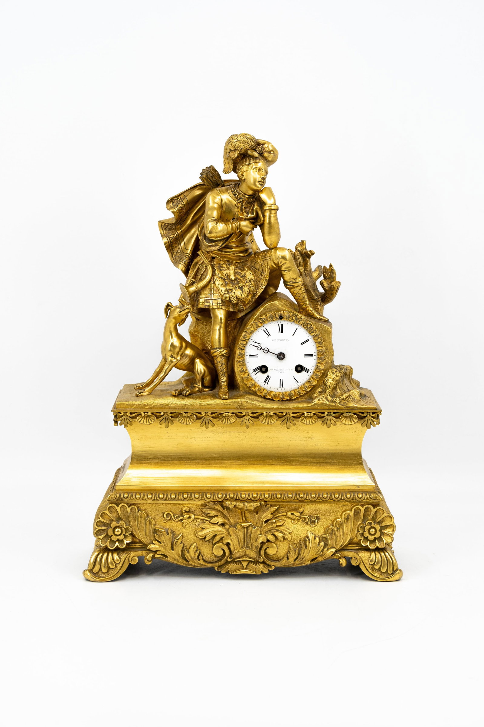 An antique French gilt bronze figural mantel clock representing of hunter and his dog: An antique French gilt bronze figural mantel clock representing of hunter and his dog. 19th century. H: 47 - W: 34 cm