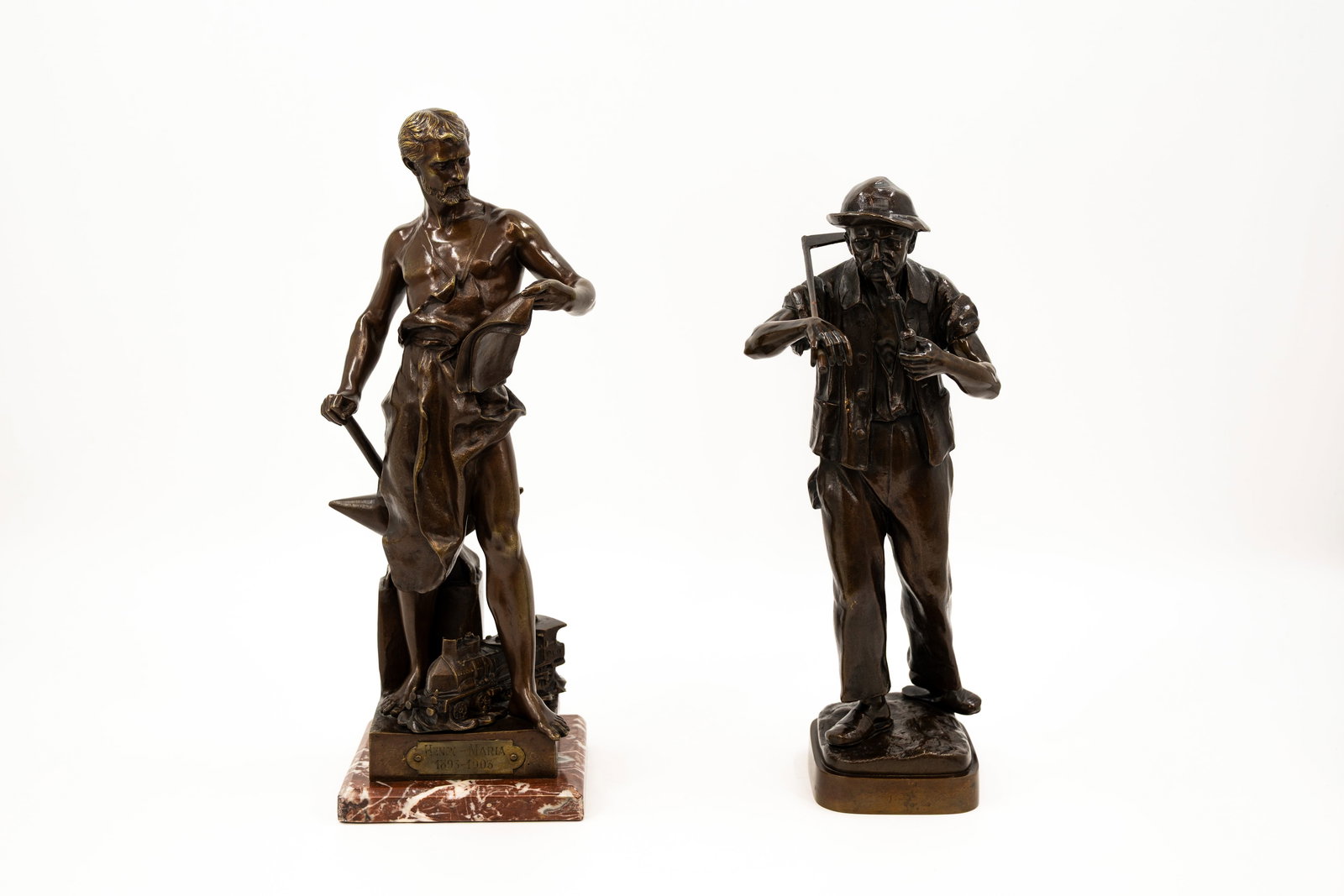A composed lot of two French antique patinated bronze figural sculptures: A composed lot of two French antique patinated bronze figural sculptures of working men, one representing a farmer, signed "Jäger" and one representing a smith "Le Forgeron" signed Jean-Baptiste GERM