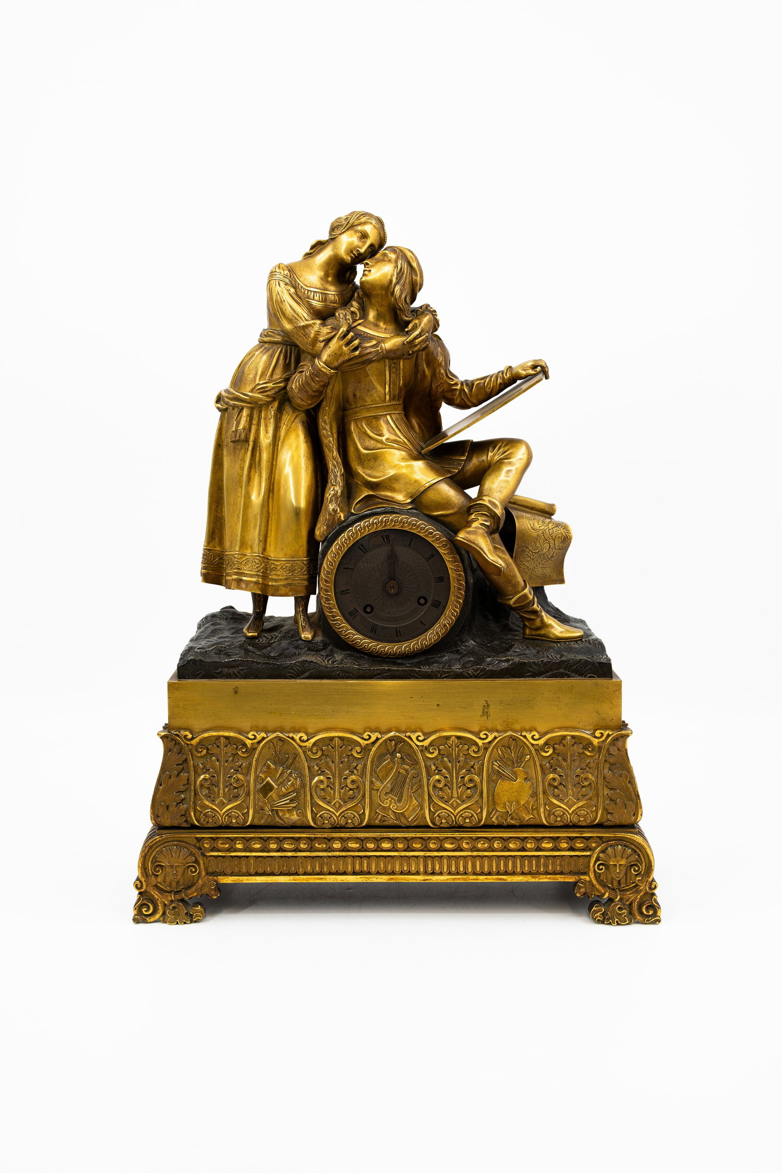 An antique Charles X-style gilt bronze figural table clock with a romantic scene (1 of 11)