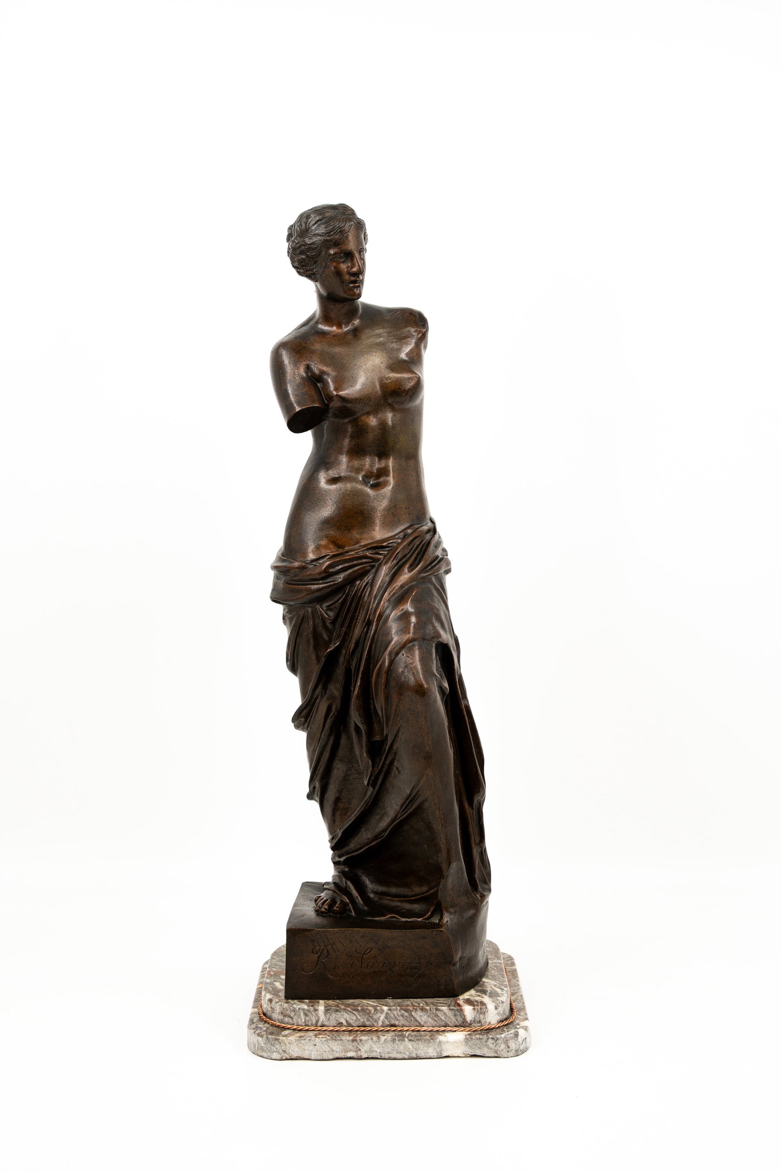 Ron Liod SAUVAGE (XIX-XX) "Venus de Milo" A large antique patinated bronze sculpture: Ron Liod SAUVAGE (XIX-XX) A large antique patinated bronze sculpture inspired by the Venus de Milo. Footed on a marble base. Signed R Sauvage. Circa 1900. H: 65 cm, without base