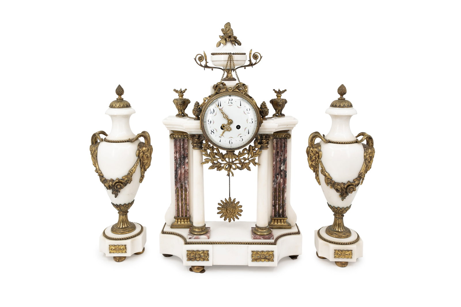 A large and antique neoclassical bi-color marble mantel clock with two matching casolettes: A large and antique neoclassical bi-color marble mantel clock with two matching casolettes and gilt bronze decorated mountings. Circa 1900. The clock is missing one piece of the base. Report available