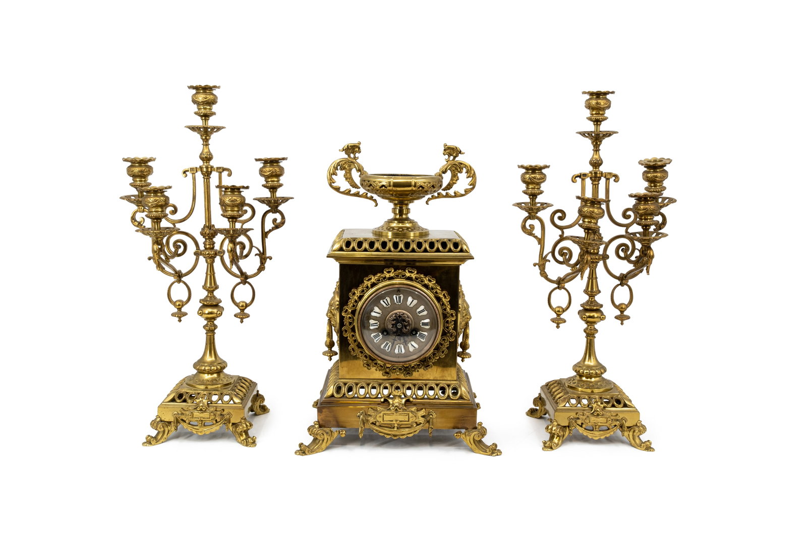An antique matching Louis XVI style gilt bronze mantel clock set: An antique matching Louis XVI style gilt bronze mantel clock set. Circa 1900. H: 44 - W: 31 cm, clock