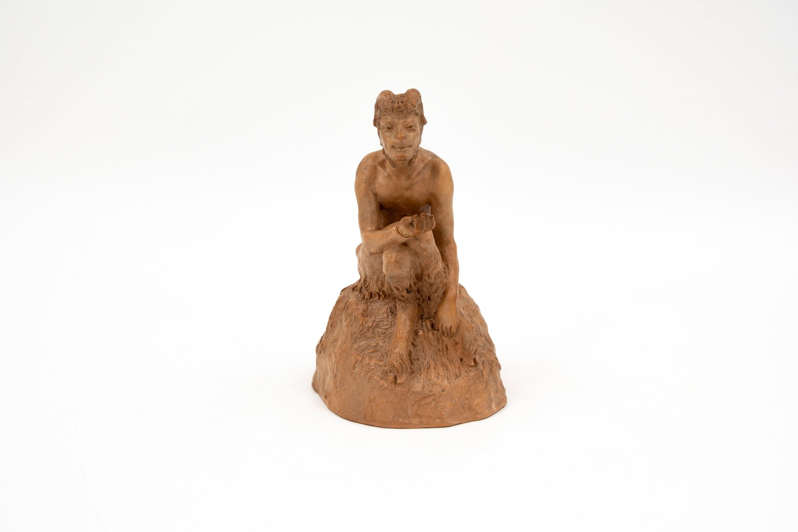 Joé DESCOMPS (1869-1950) A patinated terracotta figurine representing a faun: Joé DESCOMPS (1869-1950) A patinated terracotta figurine representing a faun. Signed, circa 1900. Condition: his hand has been glued, condition report available on request. H: 16,8 cm